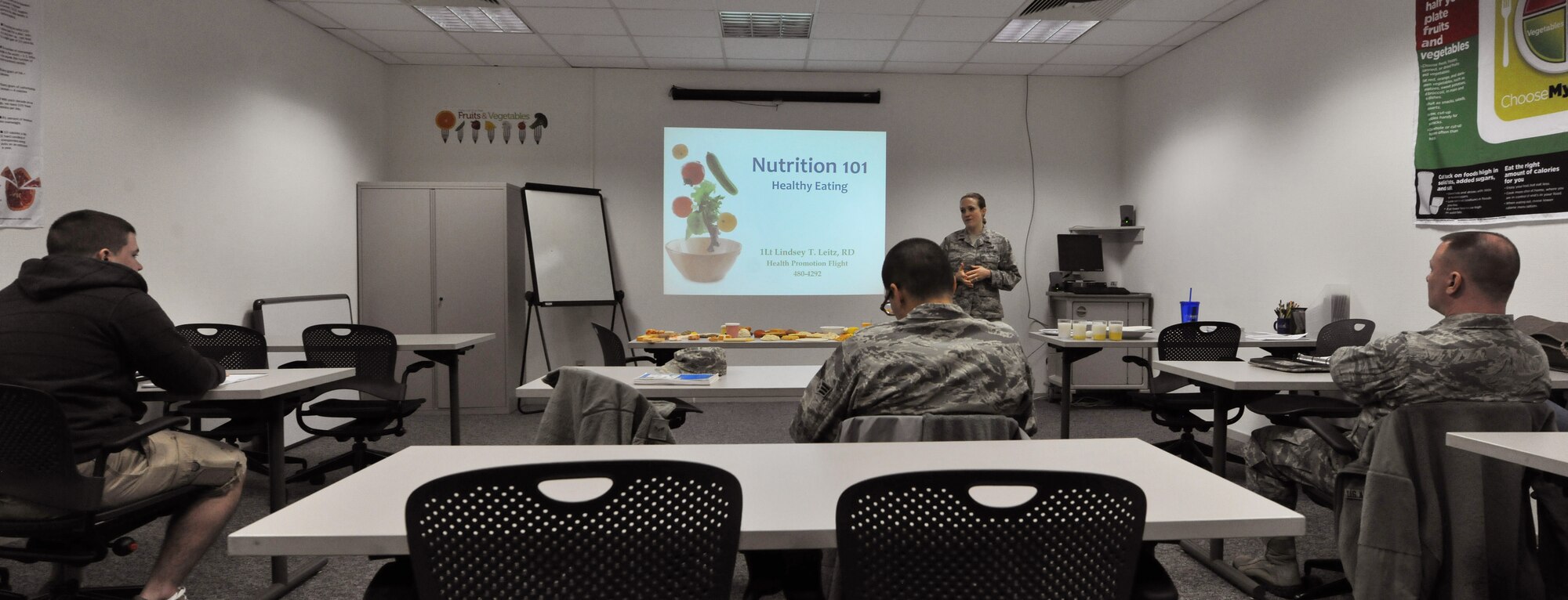 First Lt. Lindsey Leitz, Health Promotion nutrition program manager, teaches the Healthy Living Class at Ramstein Air Base, Germany, Feb. 9, 2015. The class addresses many myths and misinformation pertaining to health and fitness. (U.S. Air Force photo/A1C Tryphena Mayhugh)