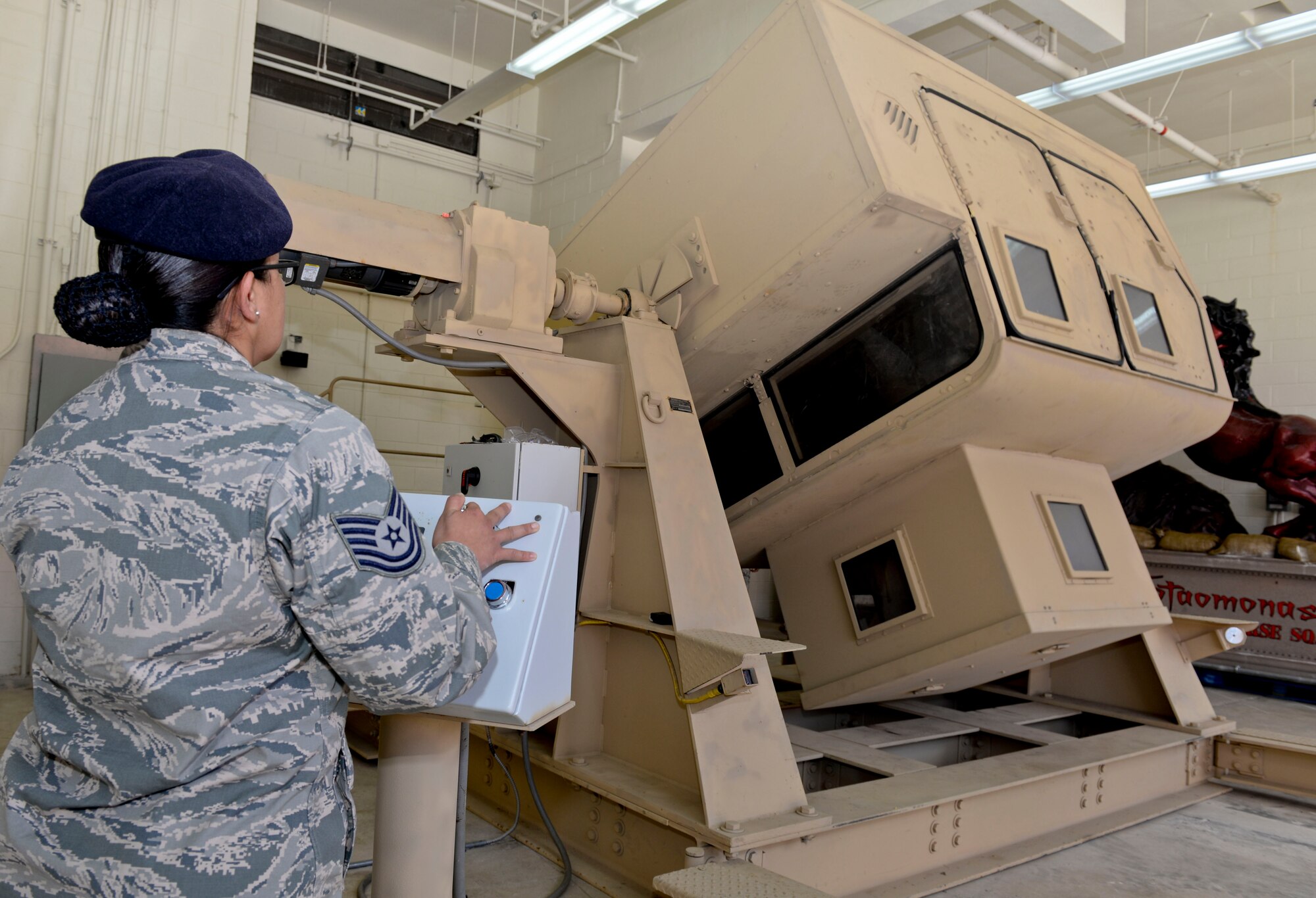 Brig. Gen. Andrew Toth, 36th Wing commander and Chief Master Sgt. Michael McMillan, 36th Wing command chief, participate in Humvee rollover simulator training during an immersion tour Feb. 12, 2015, at Andersen Air Force Base, Guam. Toth and McMillan got a closer look at the capabilities the Guam Air National Guard brings to the island and the mission at Andersen AFB.  (U.S. Air Force photo by Staff Sgt. Robert Hicks/Released)  