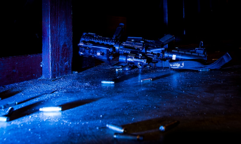 JOINT BASE CHARLESTON, S.C. – An M-4 carbine rifle is placed at the firing line with no bullets in the chamber and the safety on after Airmen participated in a qualifying session at night at the Combat Arms Training and Maintenance firing range, Feb. 11, 2015, on Joint Base Charleston, S.C. The 628th Security Forces Squadron patrolmen fire more than 200 rounds during the course and are required to accomplish this course annually. (U.S. Air Force photo/ Senior Airman Dennis Sloan)