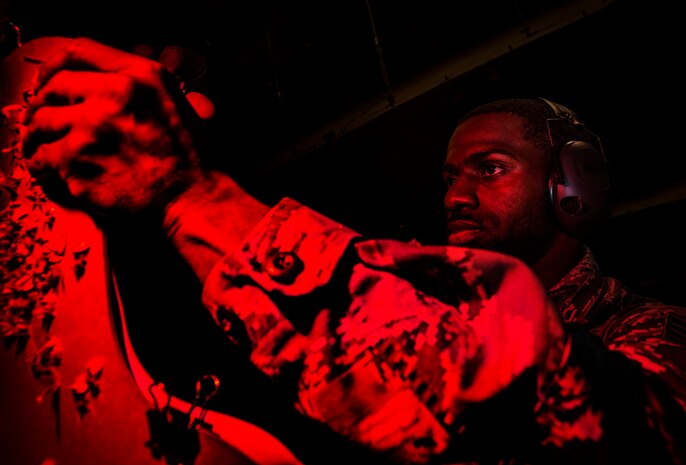 JOINT BASE CHARLESTON, S.C. – Staff Sgt. Norman Allen, 628th Security Forces Squadron patrolman, looks at his target sheet after performing an M-4 carbine qualifying session at night at the Combat Arms Training and Maintenance firing range, Feb. 11, 2015, on Joint Base Charleston, S.C. Airmen fire more than 200 rounds during the course and are required to accomplish this course annually. (U.S. Air Force photo/ Senior Airman Dennis Sloan)