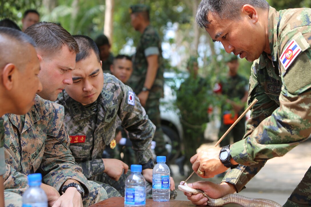 a-thai-military-instructor-known-as-the-snake-man-shows-the-size-of