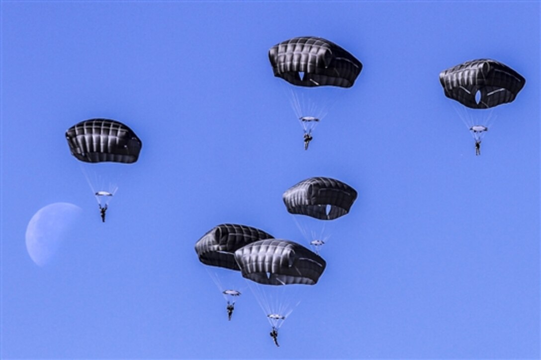 Army paratroopers descend toward Holland drop zone during an airborne proficiency jump on Fort Bragg, N.C., Feb. 11, 2015, The soldiers are assigned to the 82nd Airborne Division's 3rd Brigade Combat Team.
