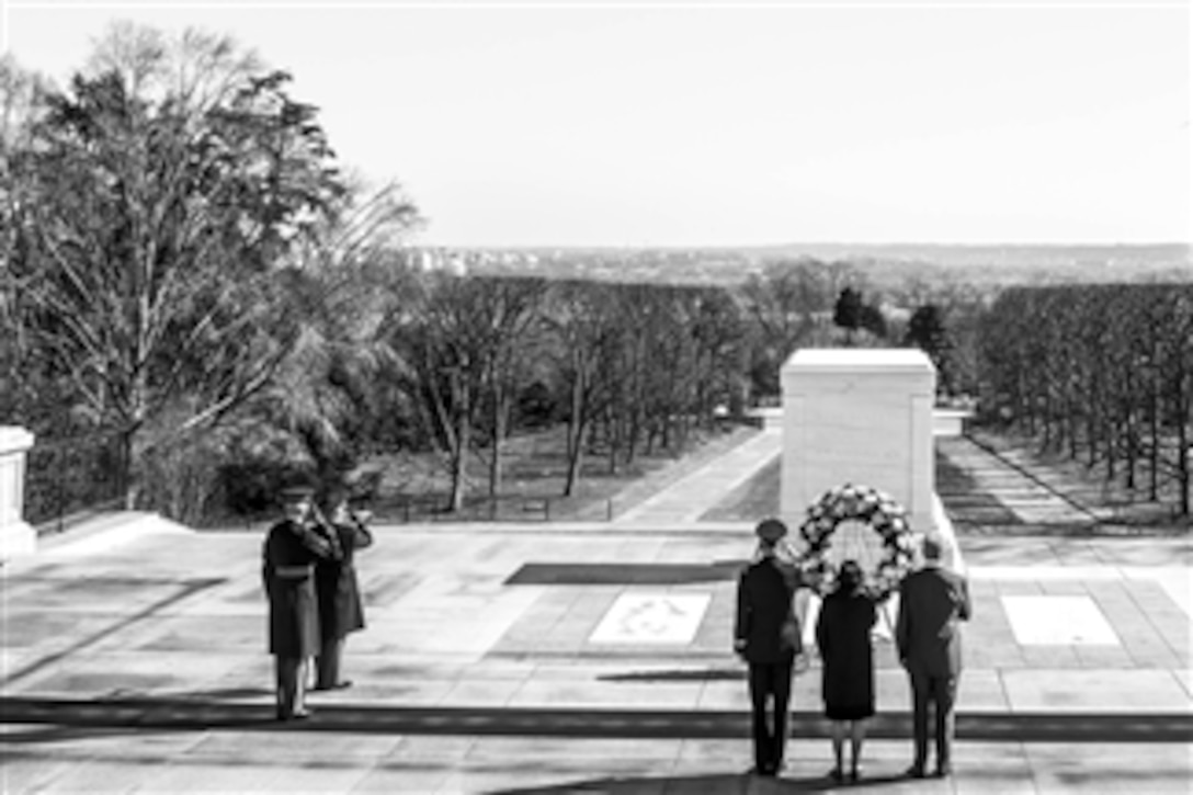 During his last week in office, Defense Secretary Chuck Hagel, far right, visited the Tomb of the Unknown Soldier at Arlington National Cemetery in Arlington, Va., Feb. 11, 2015.