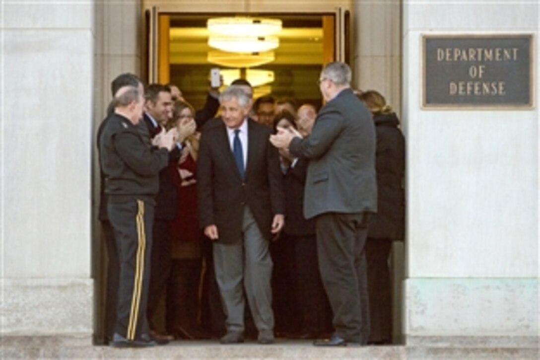 Outgoing Defense Secretary Chuck Hagel receives a traditional clapping-out ceremony on his final work day as he leaves the Pentagon, Feb. 13, 2015. Hagel, the 24th defense secretary, is the only enlisted veteran to have been appointed to the cabinet position. The Senate confirmed Ash Carter, former deputy defense secretary, to serve as the next defense secretary. 