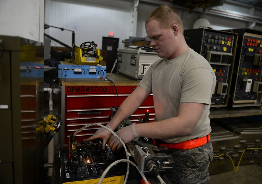 Senior Airman Robert Eby, 51st Munitions Squadron A-10 armament systems journeyman, performs an electronic test on a bomb rack Feb. 10, 2014, at Osan Air Base, Republic of Korea. To ensure that the equipment is mission ready, the armament flight regularly schedules inspections and maintenance work. (U.S. Air Force photo by Senior Airman David Owsianka)