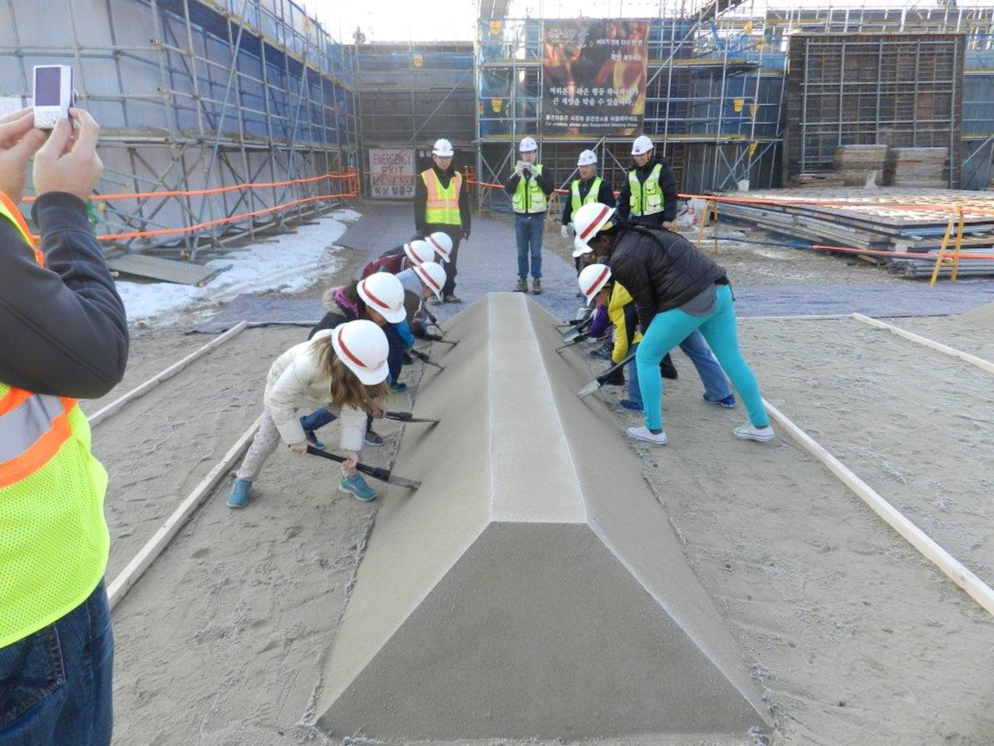 Teachers and students at Osan Air Base, Republic of Korea, visit the on-going construction project here for the new Osan Elementary School Jan. 20, 2015. The new elementary school is scheduled to open August 2016.