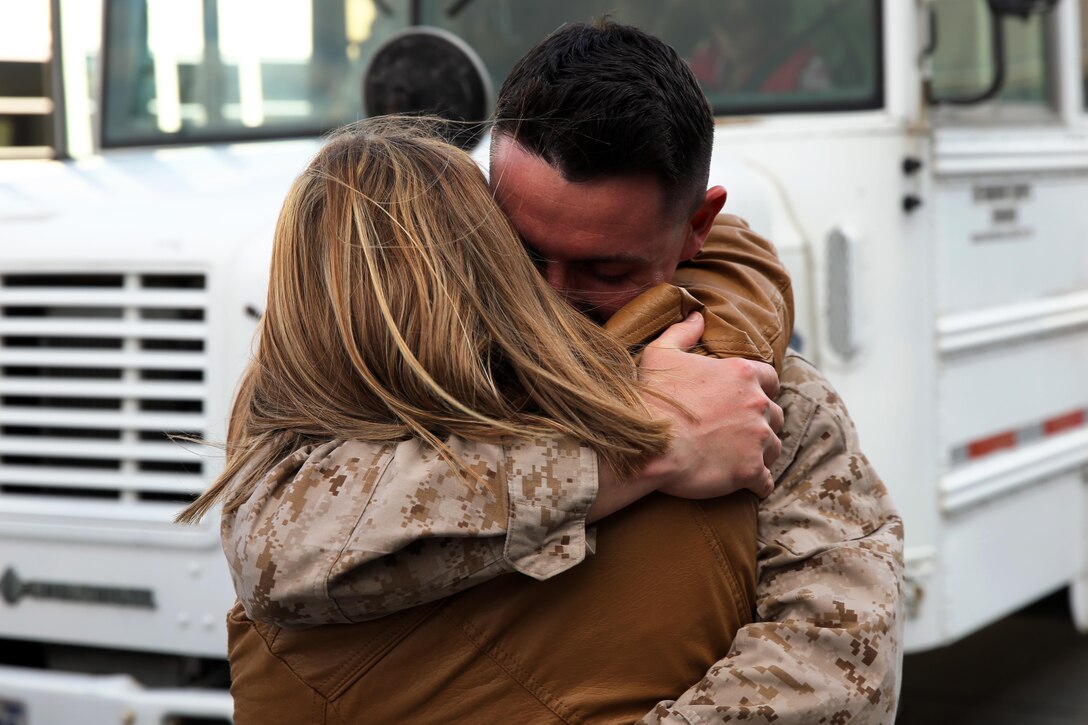 Lance Cpl. Sean P. Meara reunites with his girlfriend, Christa Rogoza, at Marine Corps Air Station Cherry Point, N.C., Feb. 5, 2015, after returning from a six-month deployment to Qatar. Meara is an aircraft communications, navigation and radar systems technician with Marine Tactical Electronic Warfare Squadron 4 and native of Hamilton, N.Y.
