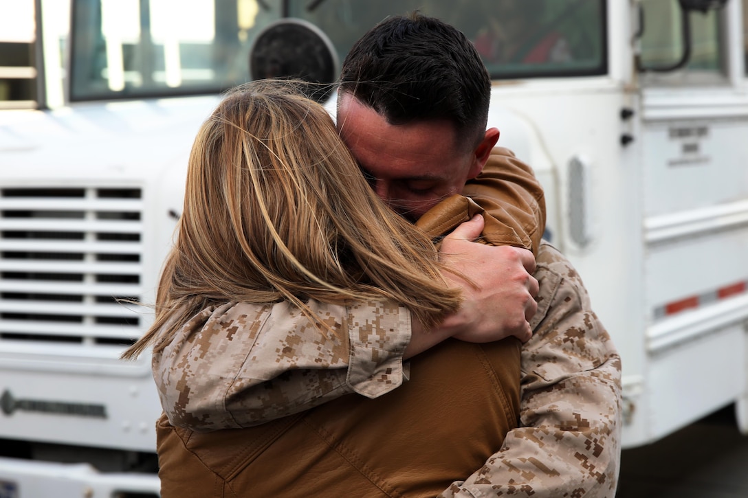 Lance Cpl. Sean P. Meara reunites with his girlfriend, Christa Rogoza, at Marine Corps Air Station Cherry Point, N.C., Feb. 5, 2015, after returning from a six-month deployment to Qatar. Meara is an aircraft communications, navigation and radar systems technician with Marine Tactical Electronic Warfare Squadron 4 and native of Hamilton, N.Y.