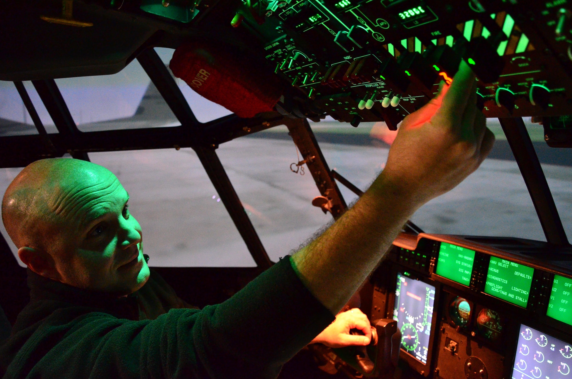 Tech Sgt. Ronnie Graham, a turboprop craftsman with the 403rd Maintenance Squadron, goes through his checklist to suppress and extinguish a fire during a fire drill in the 403rd C-103J simulator 6 Jan. Graham is one of 120 maintainer students who endure the annual maintenance engine run refresher course each year. (U.S. photo/Master Sgt. Brian Lamar) 
