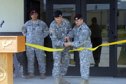 Army Col. Steven Bapp, center, and Army Lt. Col. Robert Harris cut the ribbon outside the new WTC headquarters building May 17, 2010.