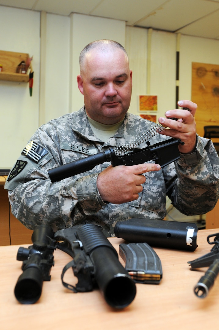 U.S. Army Sgt. Anthony Eplee of the 1/178 Field Artillery of the South Carolina Army National Guard cleans his weapon at Forward Operating Base Salerno, April 30, 2010. Eplee is a member of the security force element for the Paktika Provincial Reconstruction Team and is currently working as a liaison between the brigade and PRT commanders. Paktika PRT is a joint team whose mission is to help legitimize the government of Afghanistan through development, governance and agricultural initiatives.