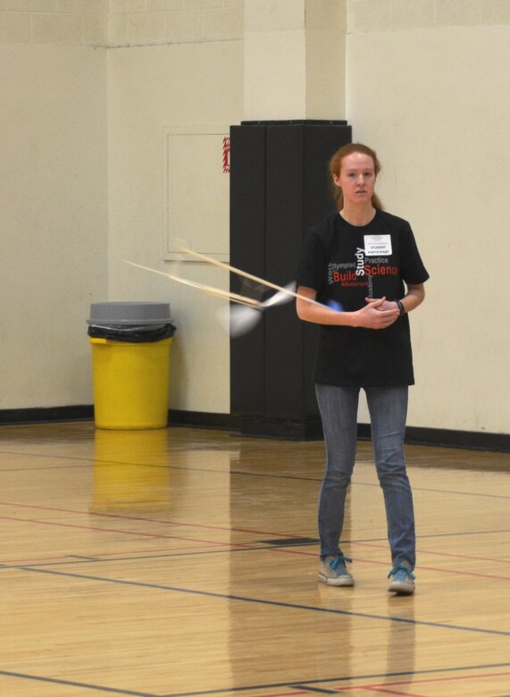 ALBUQUERQUE, N.M., -- One of the students competing in the 2015 Central New Mexico Regional Science Olympiad watches her airplane fly in “The Wright Stuff,” one of the events of the Olympiad, Jan. 31.  