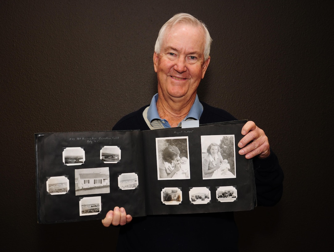 Christopher L. Carpenter shows a family album dating back to his childhood in Yermo H&R Point.  Yermo is now part of Marine Corps Logistics Base Barstow, Calif.  Carpenter donated several of his photographs to the museum at MCLBB.