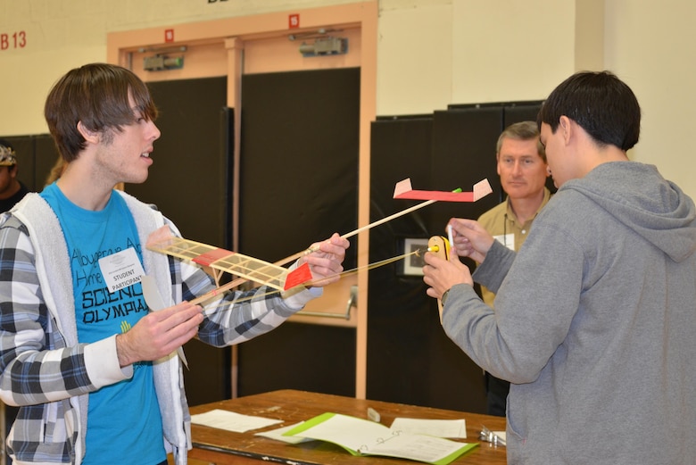 ALBUQUERQUE, N.M., -- Two students prepare their plane prior to launching it during “The Wright Stuff” event of the 2015 Central New Mexico Regional Science Olympiad, Jan. 31.

