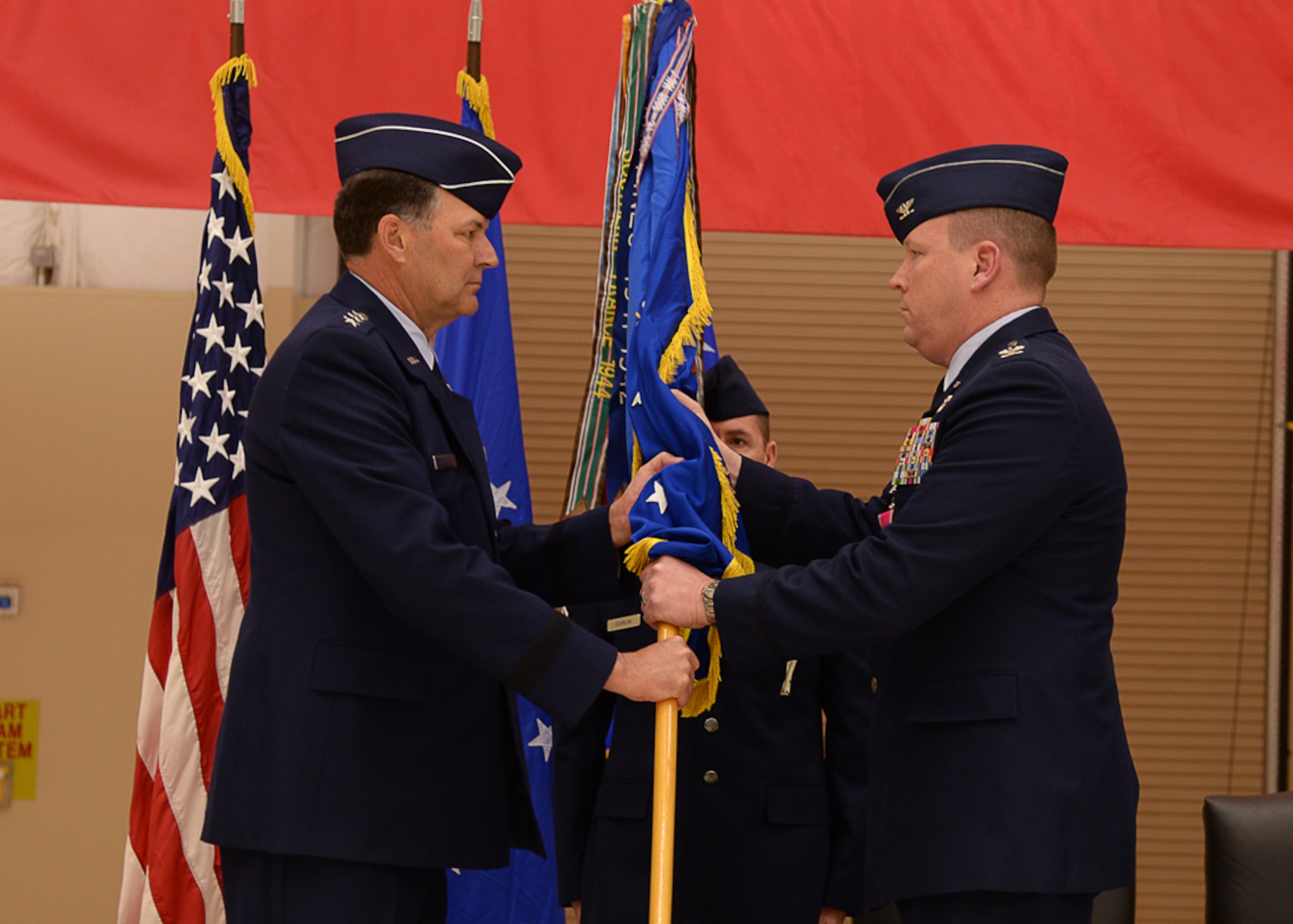 U.S. Air Force Lt. Gen. Bradley Heithold, Commander Air Force Special Operations Command, accepts the relinquishment of command from Col. Tony Bauernfeind, outgoing 27th Special Operations Wing commander, Feb. 17, 2015 at Cannon Air Force Base, N.M.  Bauernfeind was recognized for creating a first-class environment for Air Commandos and their families to thrive while leading the U.S. Air Force’s most relevant wing.  (U.S. Air Force photo/Airman 1st Class Chip Slack) 
