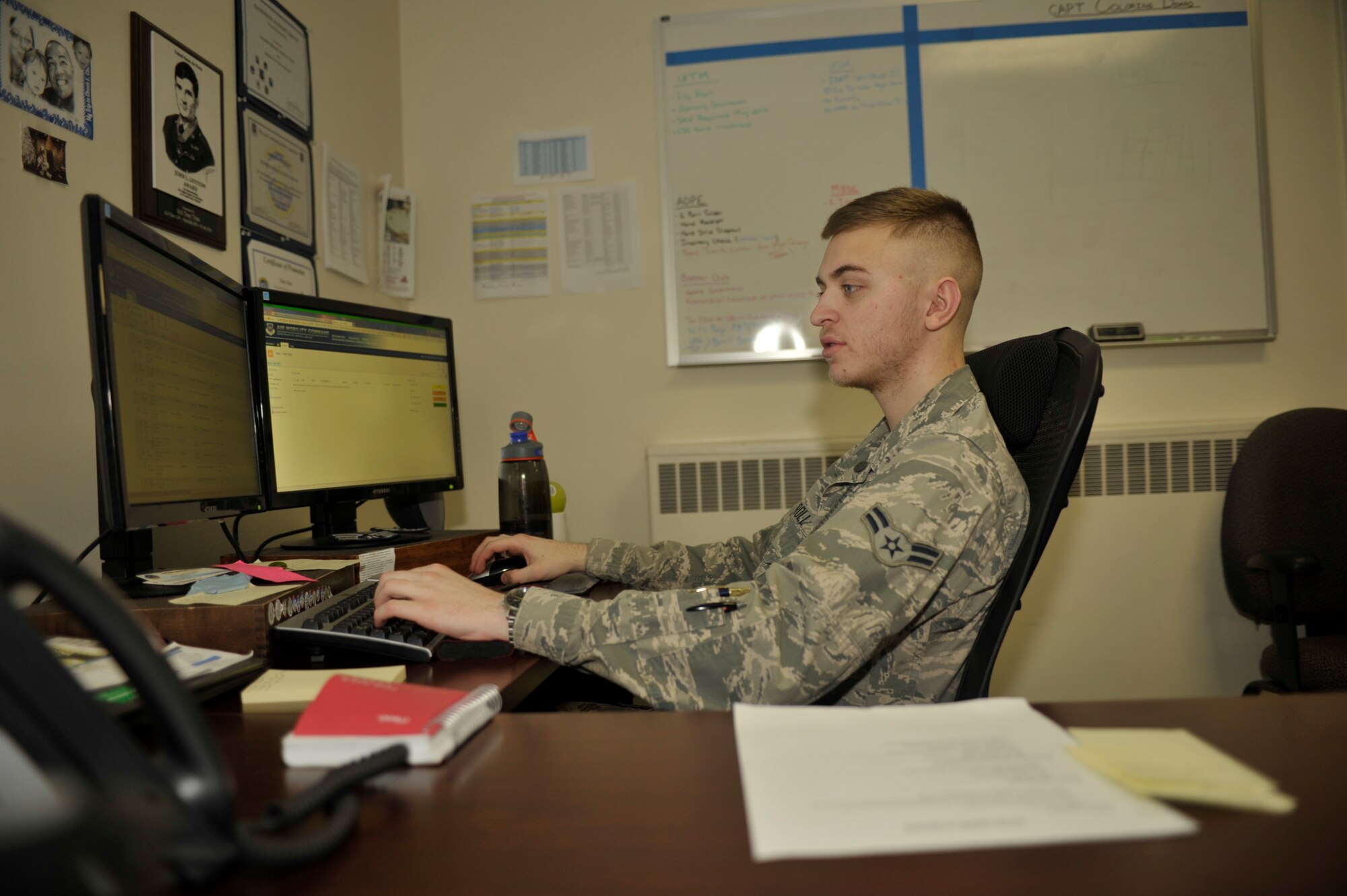 Airman 1st Class Joseph Carroll, 92nd Communications Squadron knowledge manager, gives a customer permission to Tasks Management Tool (TMT) Feb. 13, 2015, Fairchild Air Force Base, Wash. TMT is used from headquarters all the way down to the squadron level to electronically route tasks, streamlining administrative processes and saving on paper and printing costs. (U.S. Air Force photo/Airman 1st Class Taylor Bourgeous) 