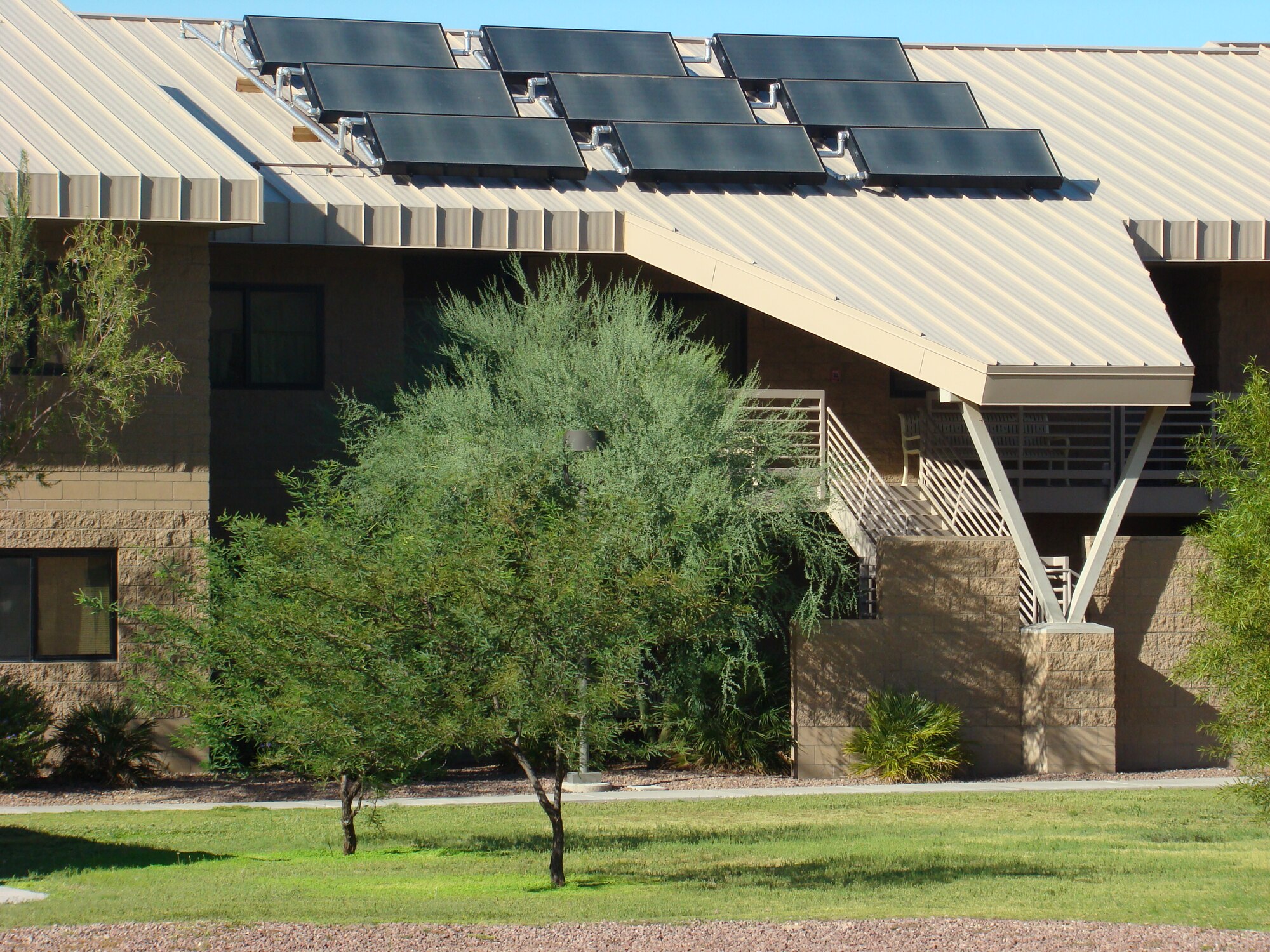 Solar panels at Davis-Monthan Air Force Base, Ariz., are one of many energy efficiency projects that helped D-M reduce energy and lower monthly electric bills, earning the base the Bright Energy Efficiency award by Tucson Electric Power. D-M's energy efficiency programs were able to save the installation a total of $235K during fiscal year 2013, successfully exceeding the federal energy goals. (Courtesy photo)
