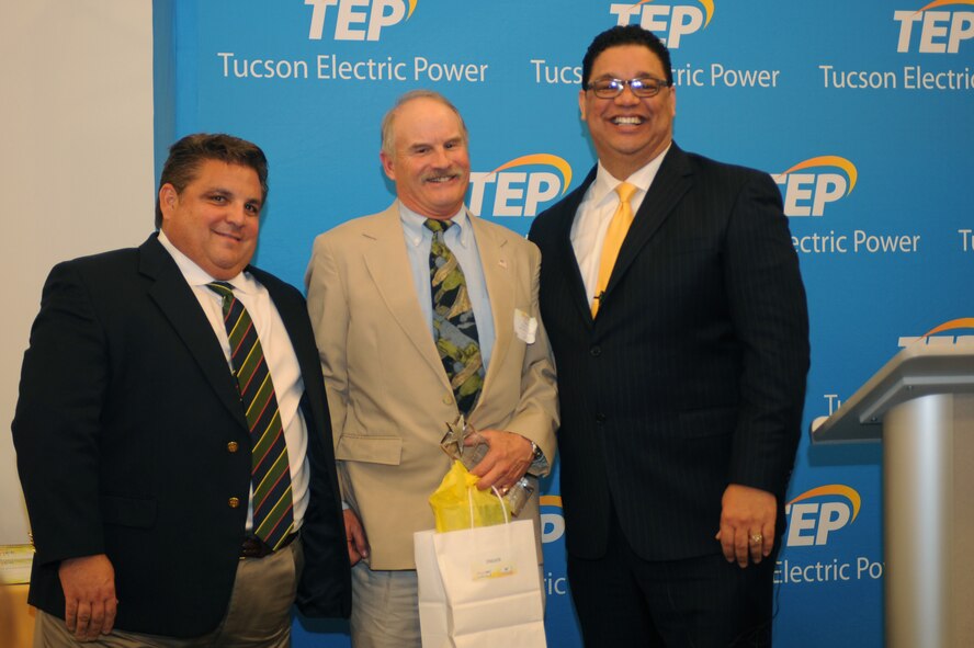 Greg Noble, 355th Civil Engineering Squadron base energy manager, accepts an award on behalf of Davis-Monthan Air Force Base, Ariz., at Tucson Electric Power Feb. 11, 2015. D-M received the Bright Energy Efficiency award for reducing their energy use and lowering monthly electric bills by adopting significant energy efficiency measures. (U.S. Air Force photo by Airman 1st Class Cheyenne Morigeau/Released) 