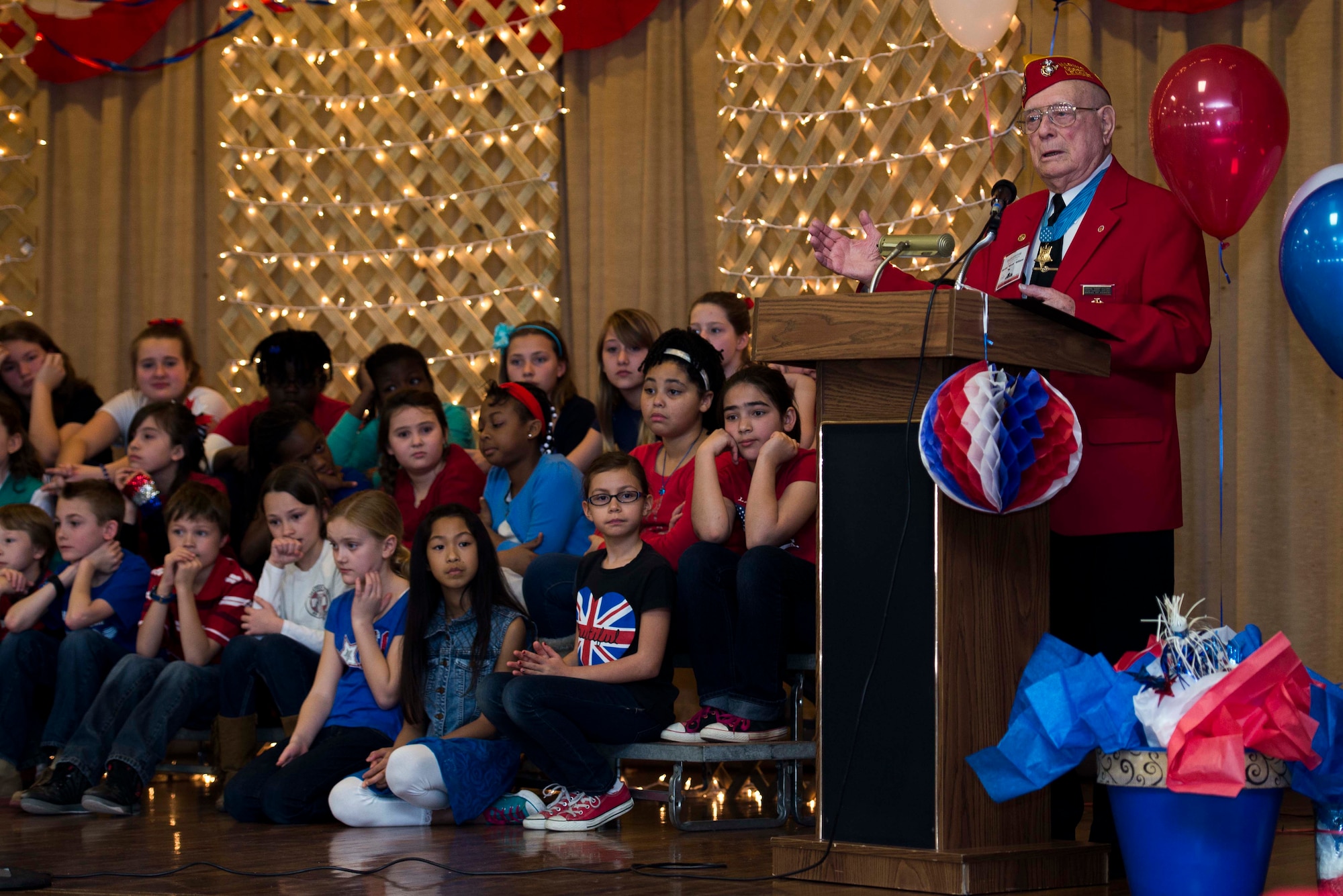 Hershel “Woody” Williams, Iwo Jima survivor and Medal of Honor recipient, tells a story to the Sheppard Elementary School students during the Iwo Jima Survivors 70th Reunion at Sheppard Air Force Base, Texas, Feb. 13, 2015. Williams shared his story of miracles during the last anniversary for the Iwo Jima survivors. He is the last living Iwo Jima Medal of Honor recipient. (U.S. Air Force photo by Senior Airman Kyle Gese/Released)