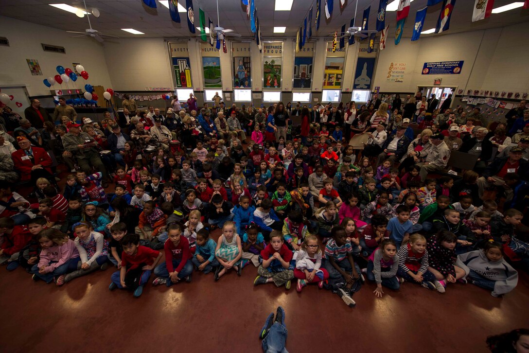 Children from Sheppard Elementary School sit in the cafeteria for the Iwo Jima Survivors 70th Reunion at Sheppard Air Force Base, Texas, Feb. 13, 2015. The elementary school children’s choir opened the event with the singing of the U.S. anthem followed by presentations for the Iwo Jima survivors. (U.S. Air Force photo by Senior Airman Kyle Gese/Released)