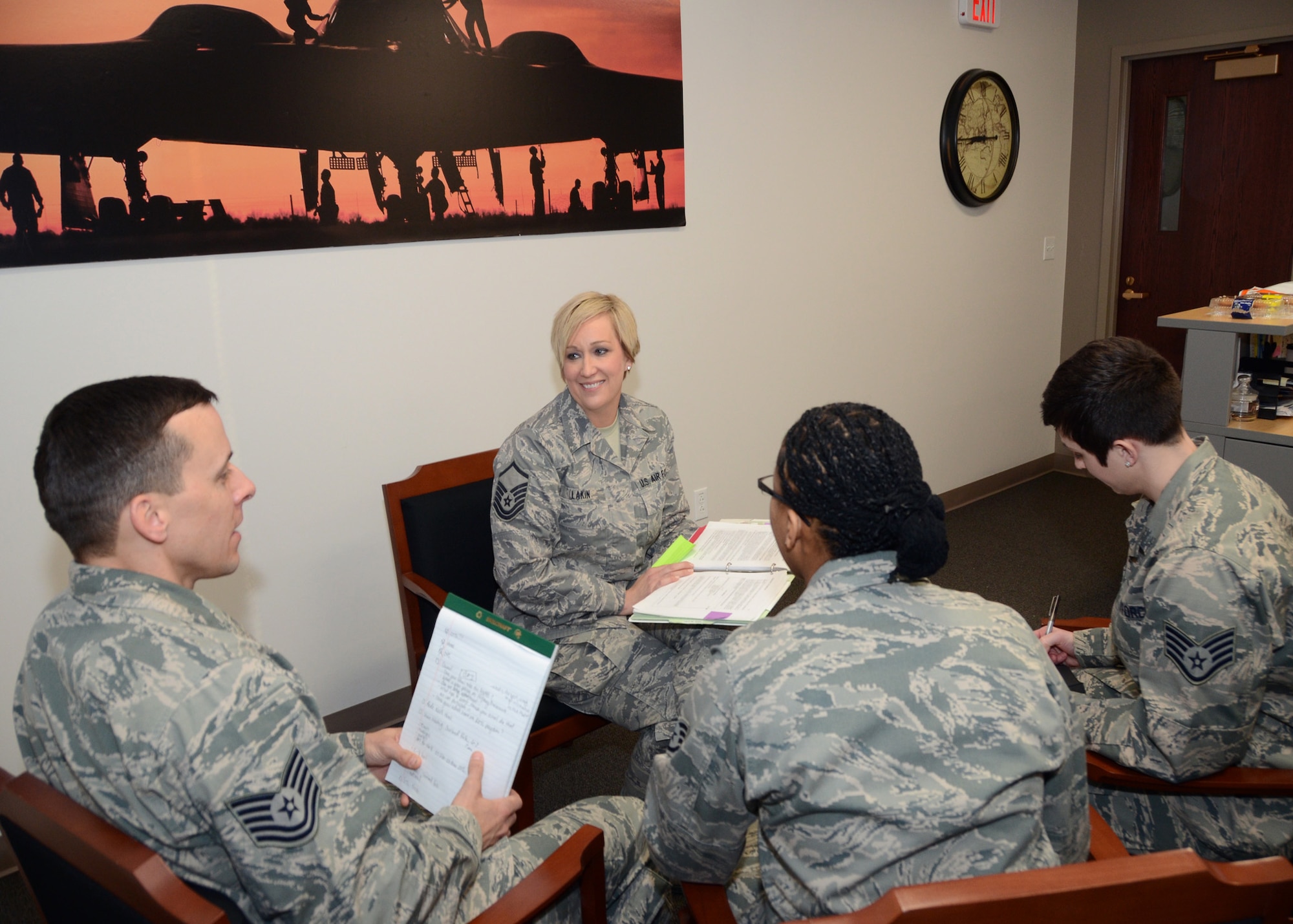 Master Sgt. Melissa Lakin, the recruiter supervisor for the Missouri Air National Guard's 131st Bomb Wing, meets with her recruiting staff at Whiteman Air Force Base, Missouri, Feb. 10, 2015.   She is the Missouri Air National Guard's 2014 Senior Non Commissioned Officer of the Year.  (U.S. Air National Guard photo by Senior Master Sgt. Mary-Dale Amison)