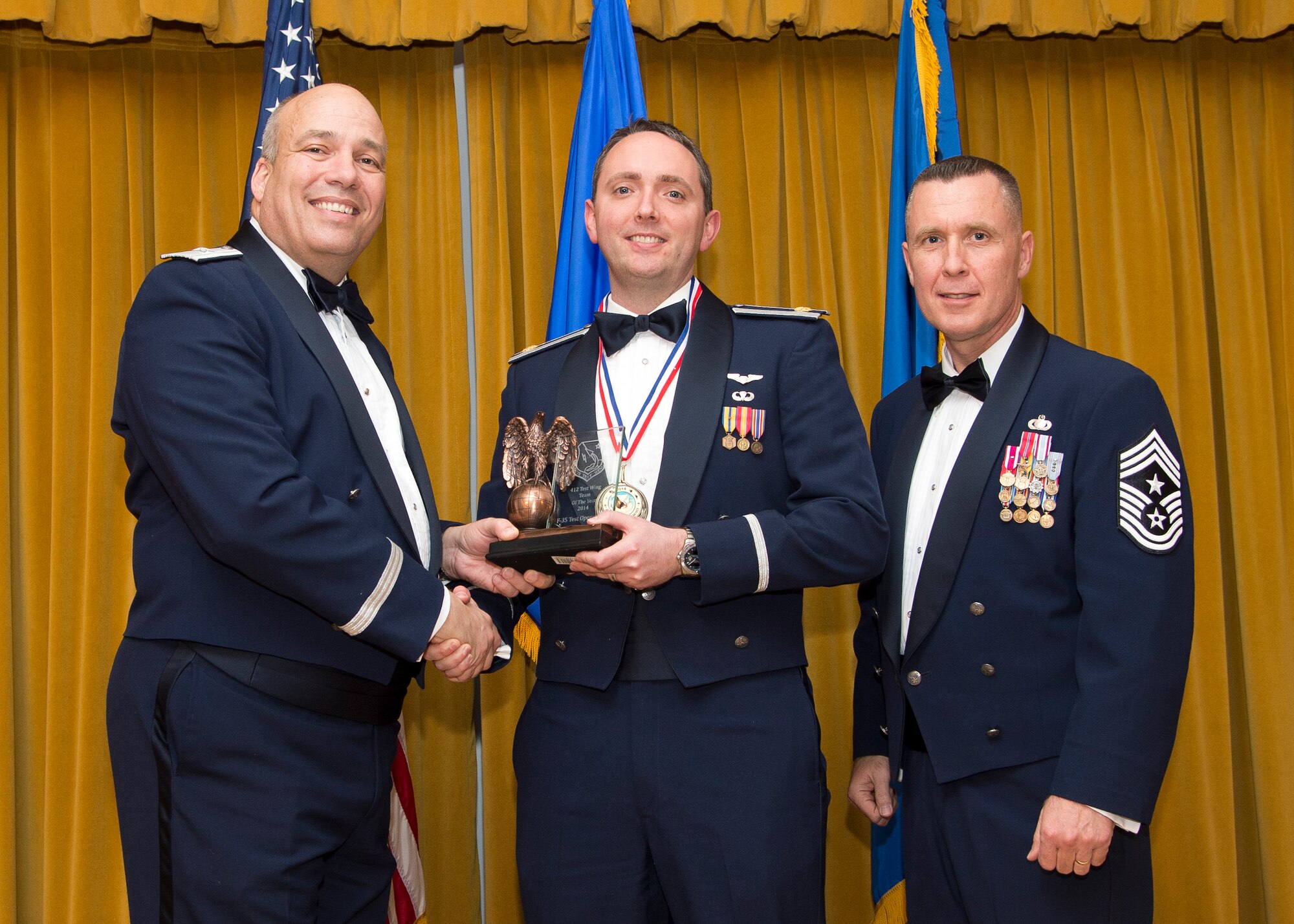 Maj. Colin Q. Hanson, 461st Flight Test Squadron, Test Operations director, accepts the Team of the Year Award, which went to F-35 Test Operations. (U.S. Air Force photo by Ethan Wagner)