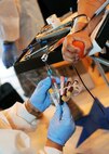 FILE PHOTO : A laboratory technician from Landstuhl Regional Medical Center, Germany, draws blood from a service member during the Armed Services Blood Program Blood Drive July 9, 2013, on RAF Mildenhall, England. The ASBP’s mission is to provide quality blood products to support worldwide medical readiness requirements and transfusion practices to care for military service members and their families. (U.S. Air Force photo by Staff Sgt. Tabitha M. Lee/Released)