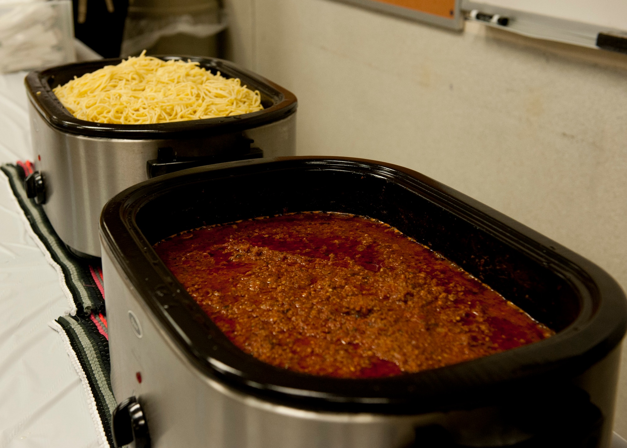 PETERSON AIR FORCE BASE, Colo. – Perfected by Father David Voelker, spaghetti sauce awaits members of Team Pete to devour it at the spaghetti dinner Feb. 12, 2015 at the Peterson Chapel. Voelker, a retired priest, shares his sauce with members of Team Pete the second Thursday of each month with a free spaghetti dinner. (U.S. Air Force photo by Senior Airman Tiffany DeNault)