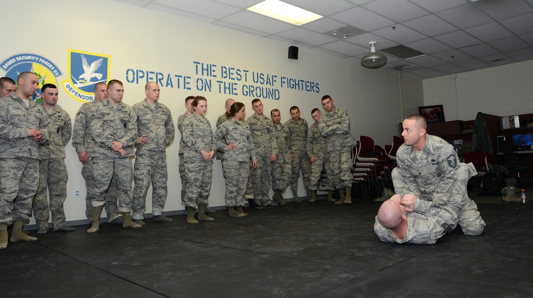 Master Sgt. Richard Marks, an instructor with the 103rd Security Forces Squadron, demonstrates to students the proper way to perform a break guard combat maneuver as part of their Air Force combatives training Feb. 7, 2015, at Bradley Air National Guard Base, East Granby, Conn. According to Marks, the training focus was on technique. (U.S. Air National Guard photo by Tech. Sgt. Joshua Mead/ released)