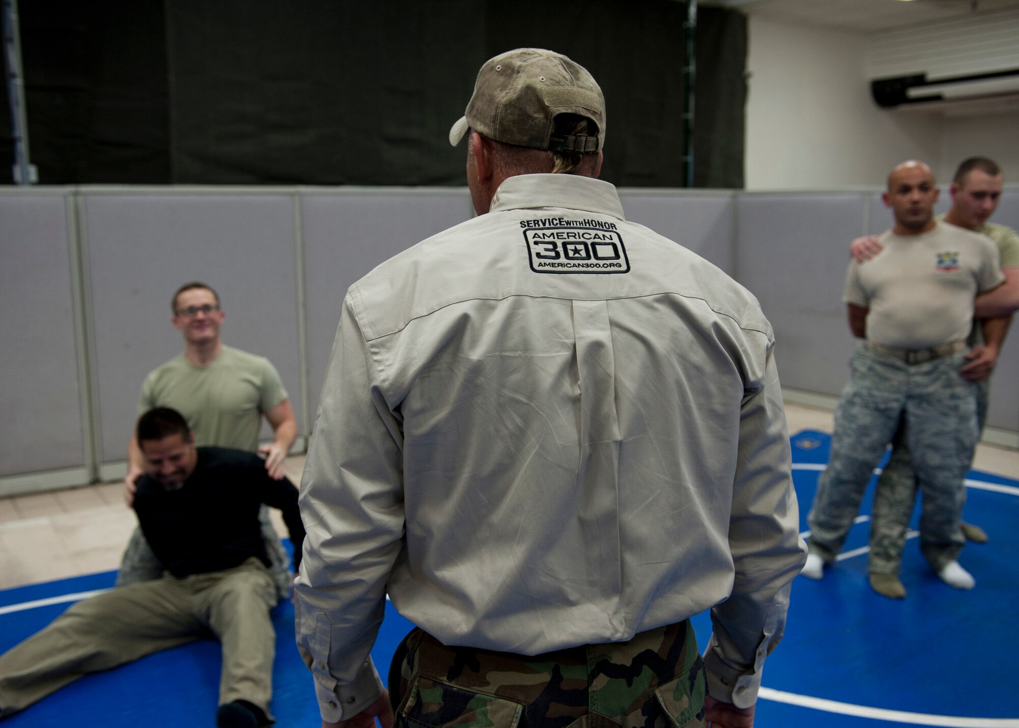 PETERSON AIR FORCE BASE, Colo. – Shannon “The Cannon” Ritch demonstrates combative skills to members of Team Pete during the American300 Tour at the 21st Security Forces Squadron Training Training Center, Feb. 10, 2015. The all-volunteer, non-profit organization tours around the world to meet members of the armed forces with subject matter resiliency experts to spend quality time, share their personal stories and provide hope. (U.S. Air Force photo by Senior Airman Tiffany DeNault)