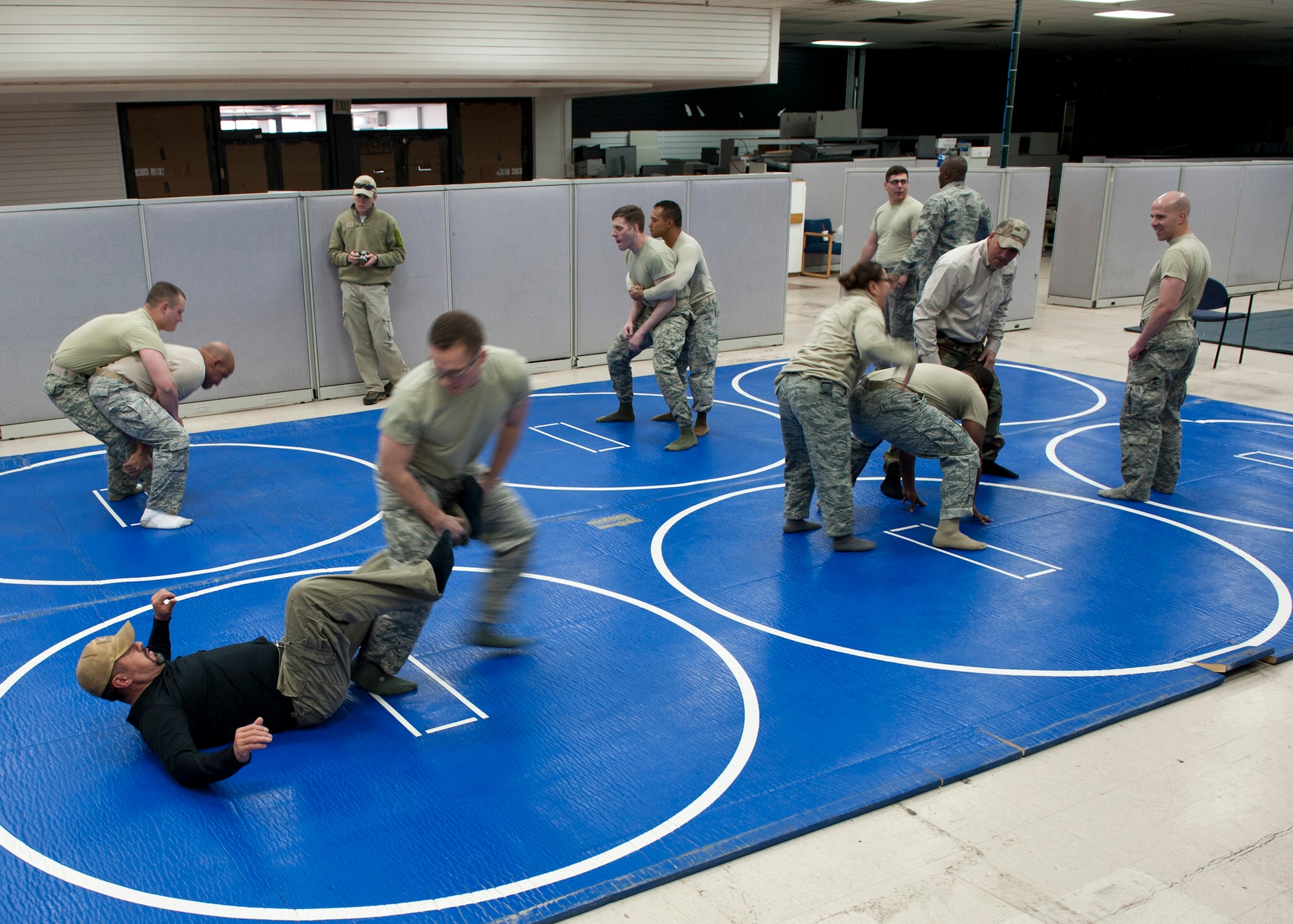 PETERSON AIR FORCE BASE, Colo. – Shannon “The Cannon” Ritch demonstrates combative skills to members of Team Pete during the American300 Tour at the 21st Security Forces Squadron Training Center, Feb. 10, 2015. The all-volunteer, non-profit organization tours around the world to meet members of the armed forces with subject matter resiliency experts to spend quality time, share their personal stories and provide hope. (U.S. Air Force photo by Senior Airman Tiffany DeNault)