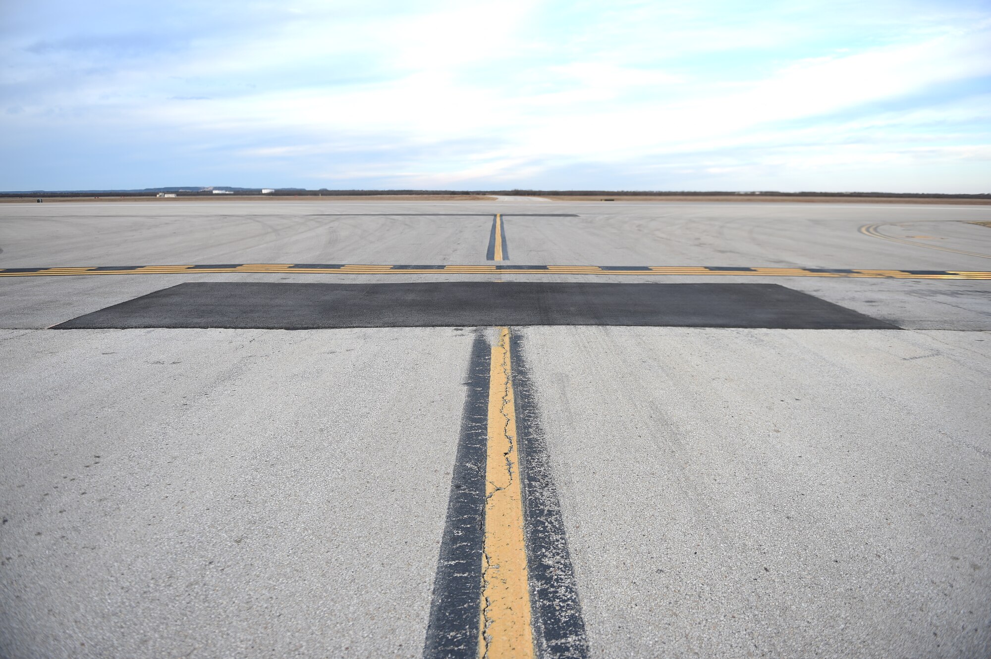 A newly-designed app was used to document  and geo-tag a damaged section of the flight line Feb. 3, 2015, at Dyess Air Force Base, Texas. The free-to-download app, designed by U.S. Air Force Master Sgt. Terrance Miller, 7th Operation Support Squadron airfield manager, allows Airmen on the flight line to take a picture of damaged sections, geo-tag it, and email it to a spreadsheet with exact coordinates to facilitate quicker response time for repairs. (U.S. Air Force photo by Airman 1st Class Alexander Guerrero/Released)