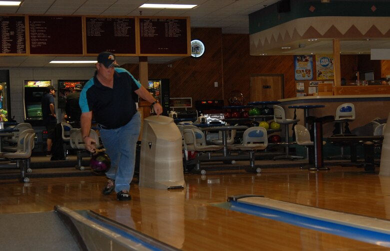 PETERSON AIR FORCE BASE, Colo. – Terry Graybeal, 21st Communication Squadron alternate information assurance officer, shows off his form at the Peterson Bowling Center. Graybeal is a long-time bowler with eight perfect 300 games to his credit. He participates in various leagues at the center and in many tournaments locally and around the country. (U.S. Air Force photo by Dave Smith)
