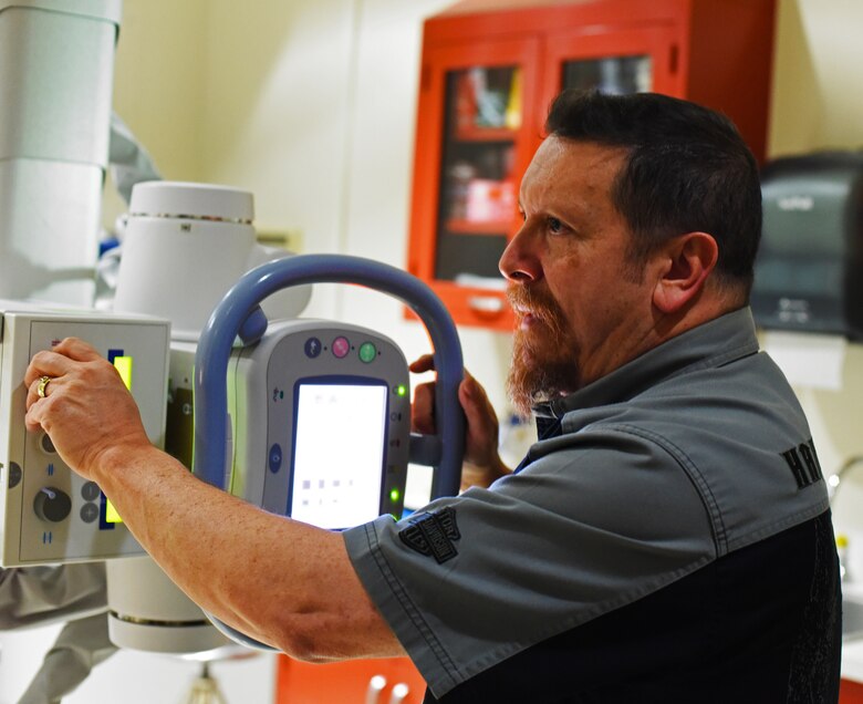 Lee Weideman, 341st Medical Support Squadron radiology technician, uses an X-ray Visual Direct Capturing System during a diagnostic imaging session at Malmstrom Air Force Base’s radiology clinic Feb 12. The visual direct capturing system is the main tool Malmstrom’s technicians use while providing radiologists with detailed imagery. (U.S. Air Force photo/Airman 1st Class Collin Schmidt)