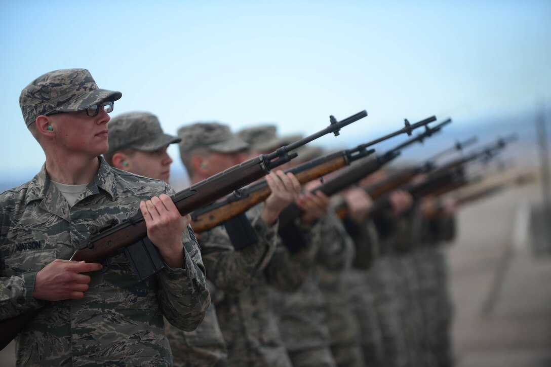 Ellsworth Honor Guardsmen practice live-firing party movements at Ellsworth Air Force Base, S.D., Feb. 9, 2015. The firing party ceremonial tradition dates back to the Civil War, and consists of firing three rounds to symbolize the removal of fallen soldiers from the battlefield. (U.S. Air Force photo by Senior Airman Zachary Hada/Released)