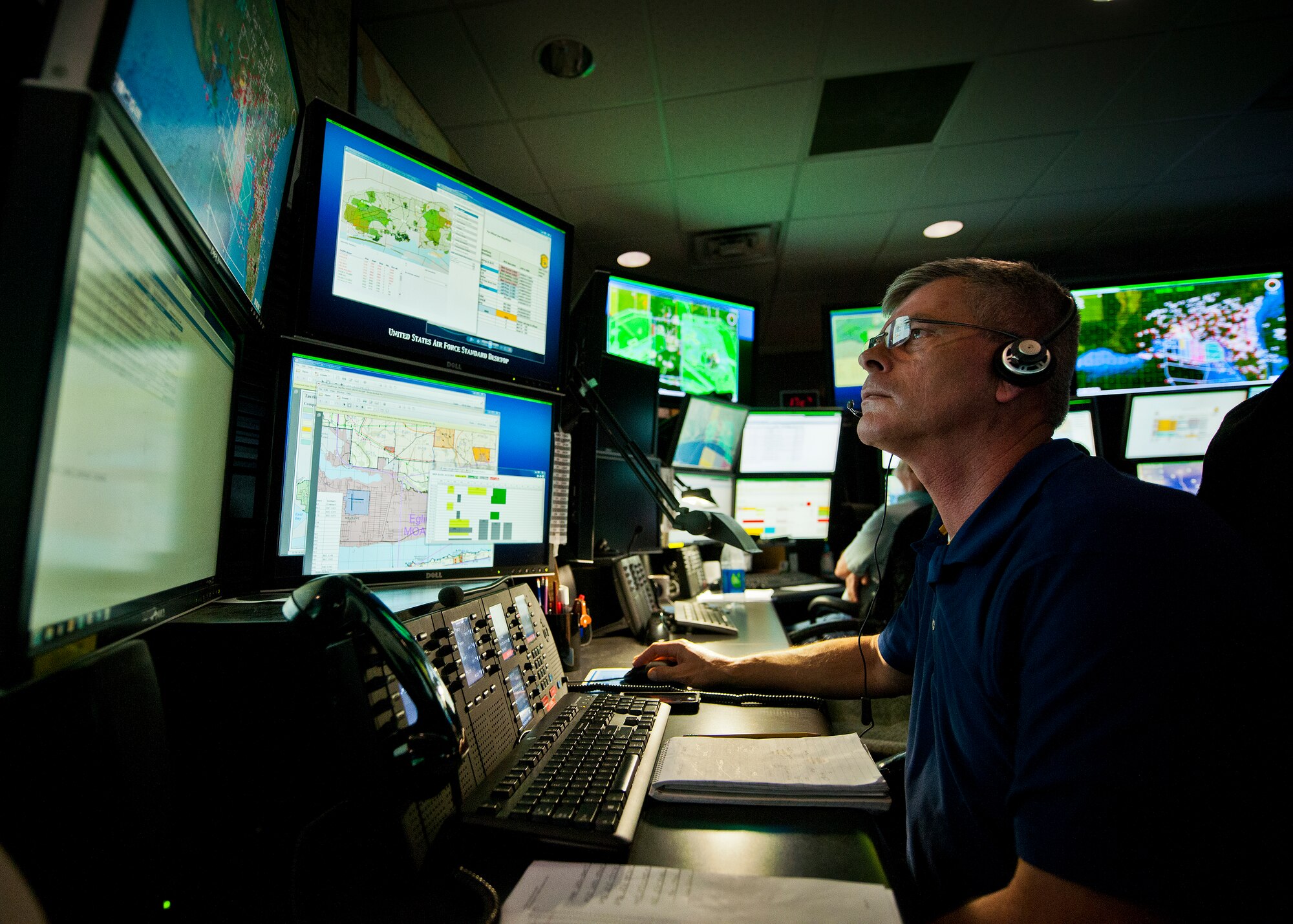 John Slater, monitors range movement from his desk at the Joint Test and Training Operations Control Center at Eglin Air Force Base, Fla.  Coordination and approval for any movement on the Eglin range must come through the center.  The center is part of the 96th Operations Support Squadron.  (U.S. Air Force photo/Samuel King Jr.)