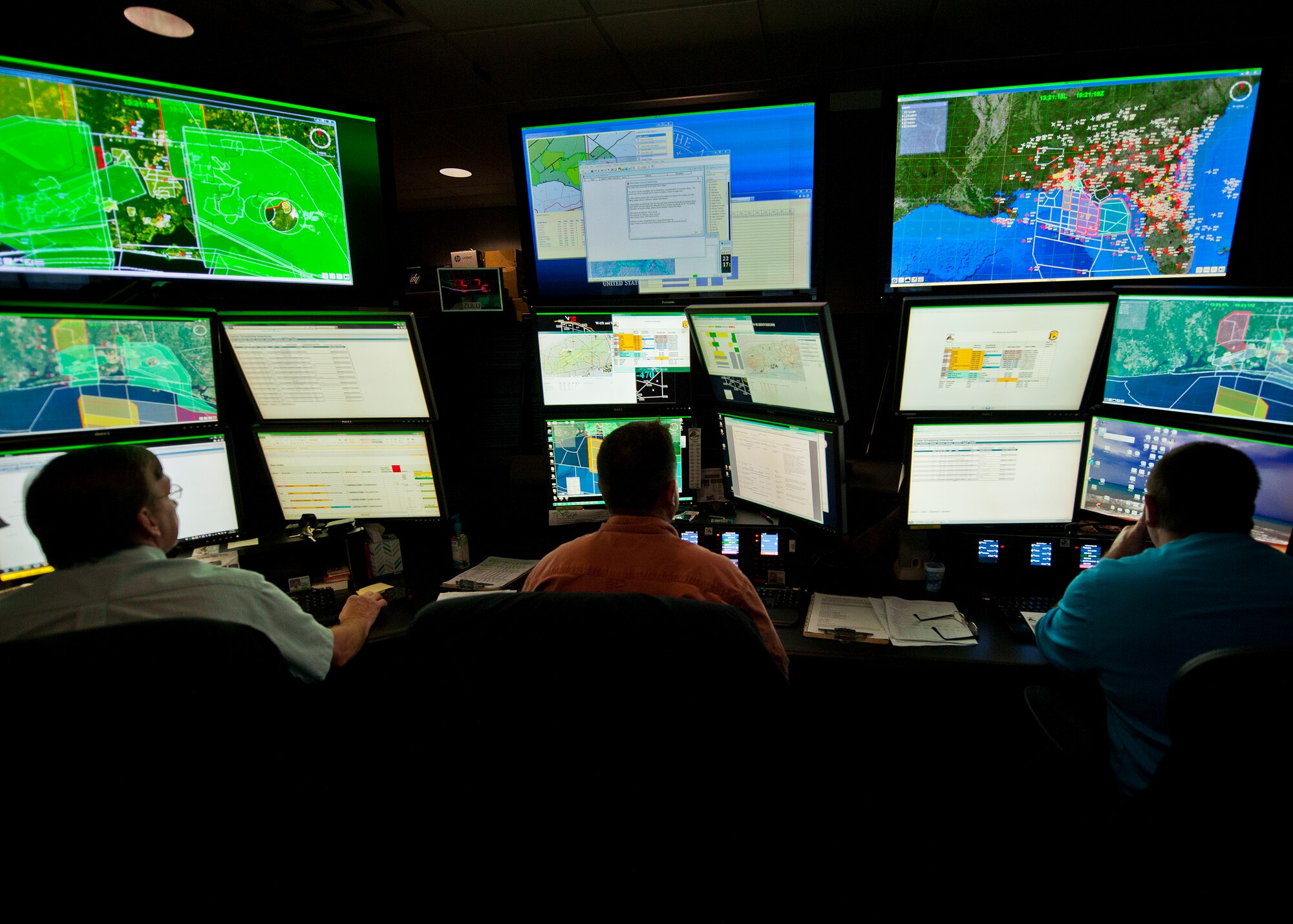 Large screens illuminate the Joint Test and Training Operations Control Center with information about weather, personnel and aircraft movement throughout Eglin Air Force Base’s land and water ranges.  Coordination and approval for any movement on the Eglin range must come through the center.  The center is part of the 96th Operations Support Squadron.  (U.S. Air Force photo/Samuel King Jr.)
