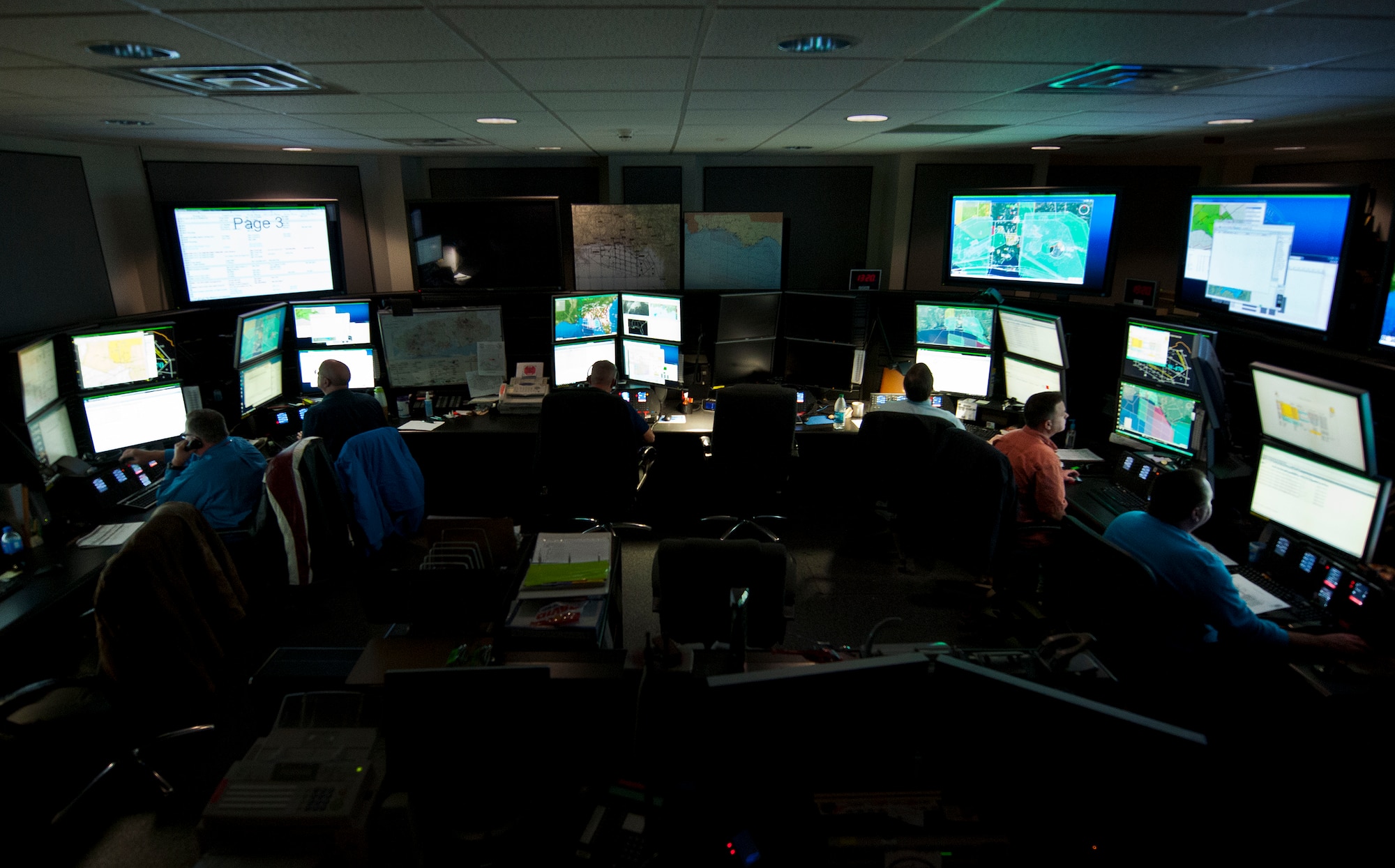 Large screens illuminate the Joint Test and Training Operations Control Center with information about weather, personnel and aircraft movement throughout Eglin Air Force Base’s land and water ranges.  Coordination and approval for any movement on the Eglin range must come through the center.  The center is part of the 96th Operations Support Squadron.  (U.S. Air Force photo/Samuel King Jr.)