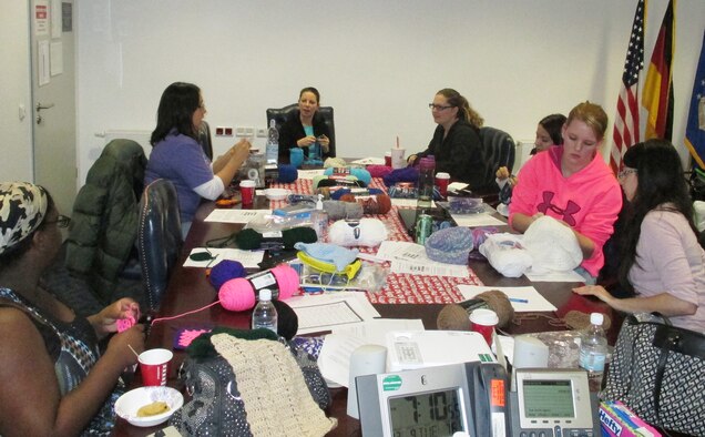 Volunteers crochet hats for patients on Ramstein Air Base, Germany. The spouses began this group in November 2014 to give back to those in need. (Courtesy Photo)