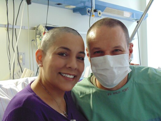 Miroslava Bingham and Lt. Col. Lowell Bingham pose for a photo, Dec. 5, 2013 at the Saarland University Medical Center in Homburg, Germany. Each one of Miroslava’s treatments consisted of 96 straight hours of chemotherapy pumped into her body. (Courtesy Photo)