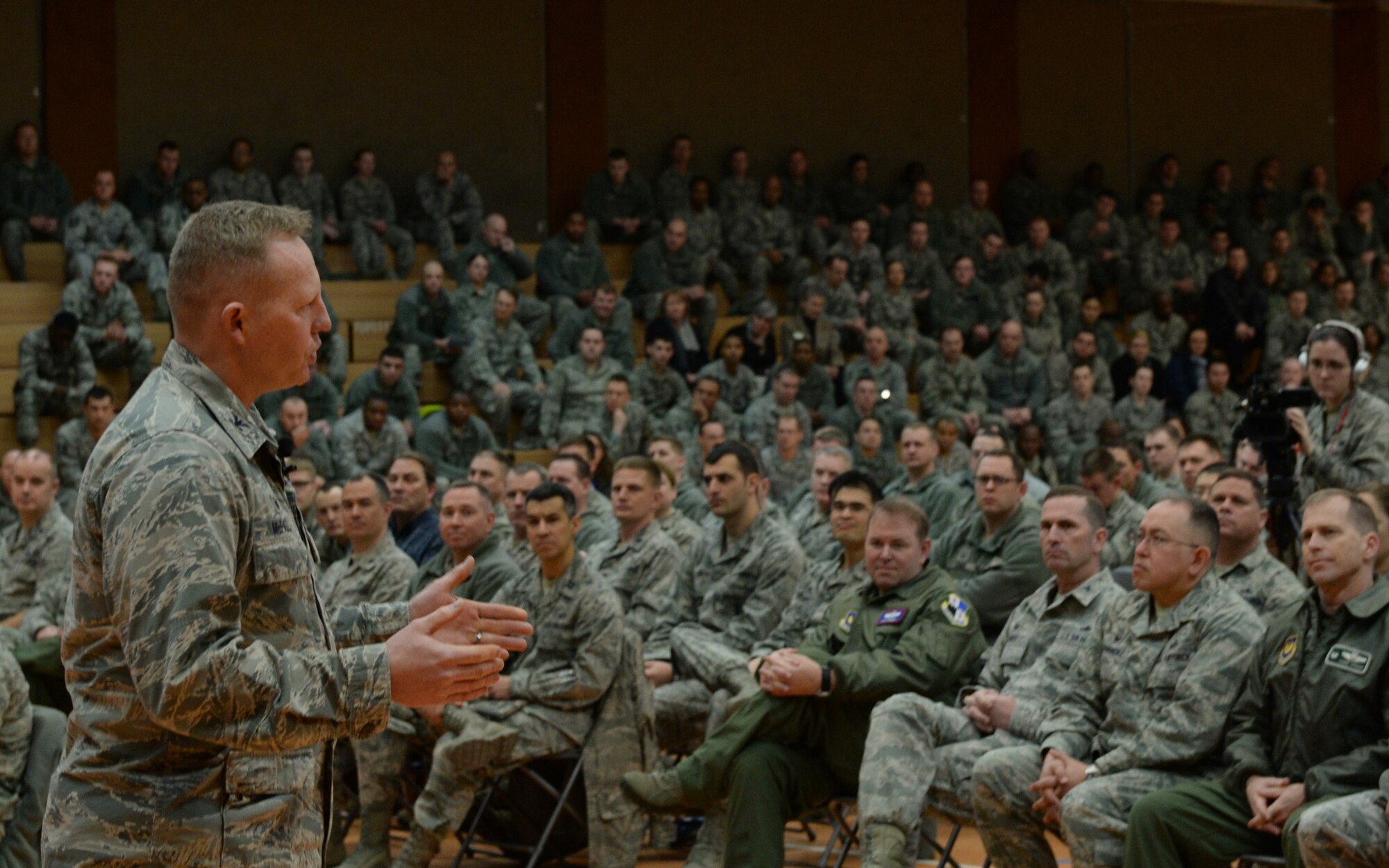 U.S. Air Force Col. Joe McFall, 52nd Fighter Wing commander, speaks during a commander’s call Feb. 17, 2015, in the Skelton Memorial Fitness Center at Spangdahlem Air Base, Germany. McFall introduced himself and talked about his background and leadership style. (U.S. Air Force photo by Senior Airman Dylan Nuckolls/Released)
