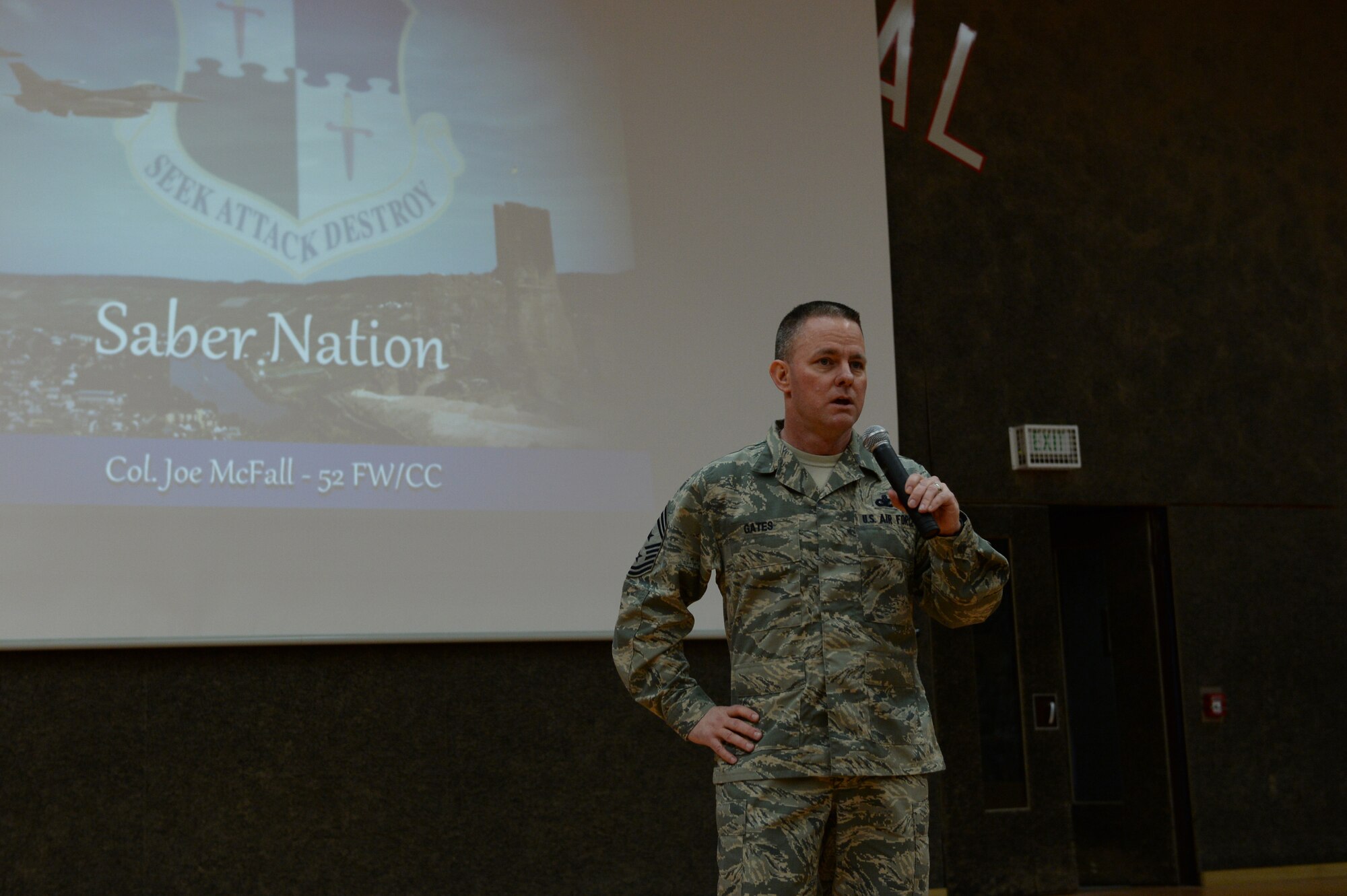 U.S. Air Force Chief Master Sgt. Brian Gates, 52nd Fighter Wing command chief, talks during a commander’s call Feb. 17, 2015, in the Skelton Memorial Fitness Center at Spangdahlem Air Base, Germany. Gates talked about his priorities and ways Airmen can combat 52nd FW issues. (U.S. Air Force photo by Senior Airman Dylan Nuckolls/Released)