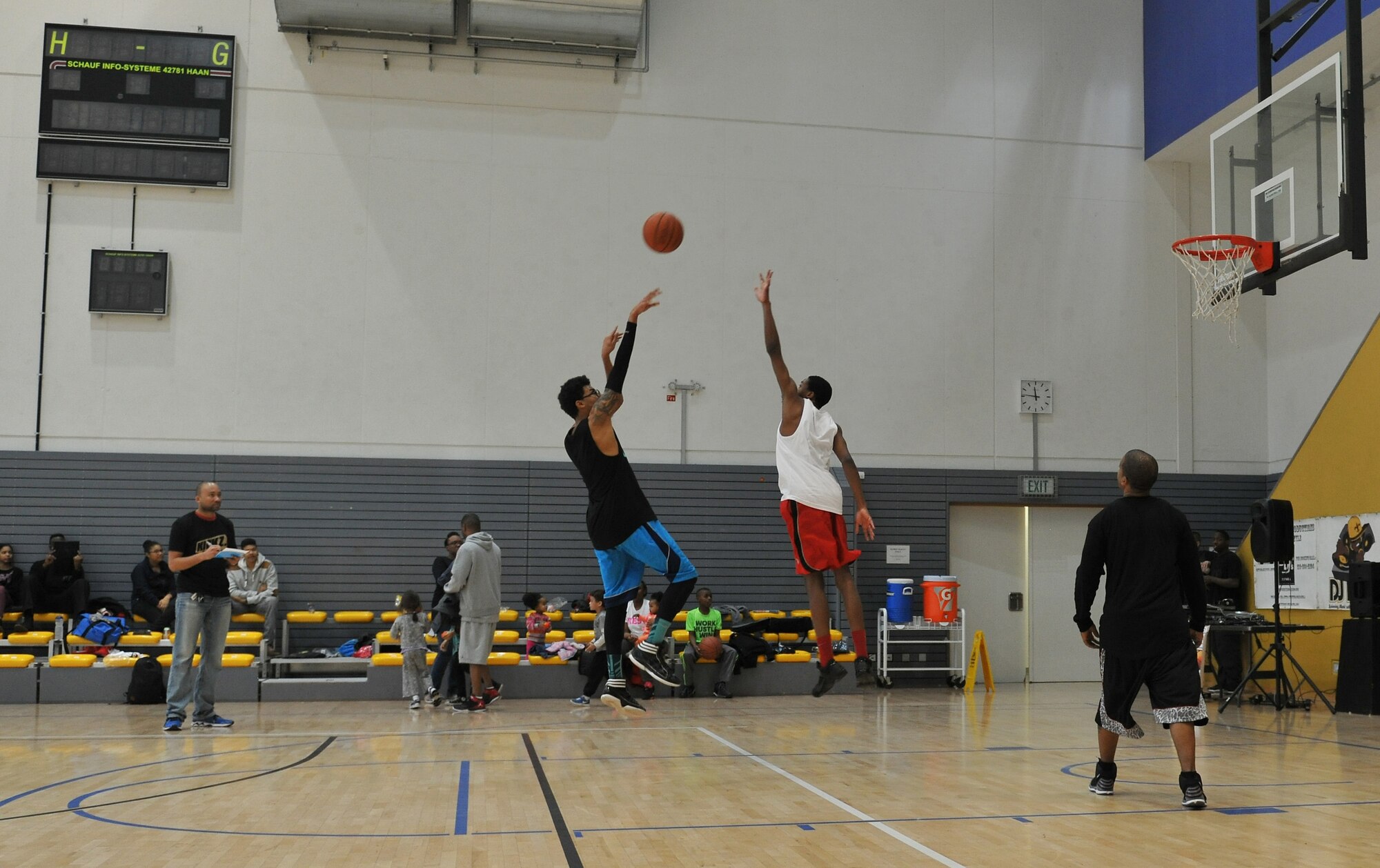 Contestants compete during the 86th Airlift Wing African-American History Month Committee’s 21-point Co-Ed Basketball Competition at Ramstein Air Base, Germany, Feb. 14, 2015. All participants received a free T-shirt, draw-string gym bag, mini basketball and a pre-paid phone card for attending. (U.S. Air Force photo/A1C Tryphena Mayhugh)