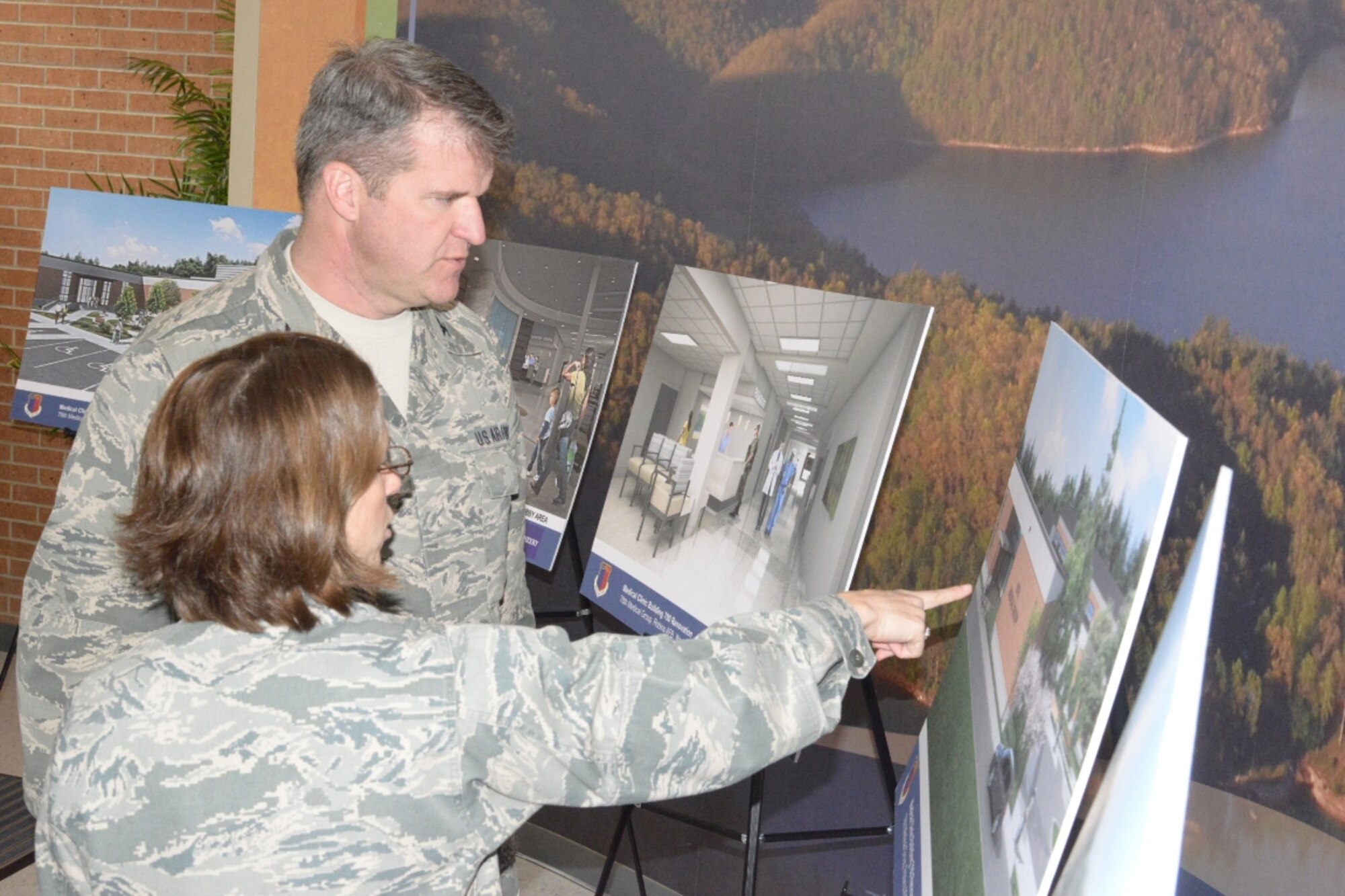 Col. Shari Silverman, 78th Medical Group commander, discusses upcoming renovations with Col. Chris Hill, Installation commander. (U.S. Air Force photo by Ray Crayton)