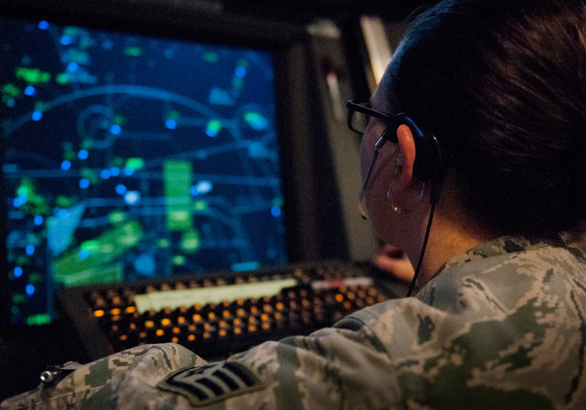 Staff Sgt. Amanda Richardson, 96th Operations Support Squadron, watches her scope from the approach controller position in the radar air traffic control facility at Eglin Air Force Base, Fla.  The Airmen and civilian radar controllers are tasked with guiding aircraft through the more than 900,000 miles of airspace from the surface to 10,000 feet within Eglin’s national airspace.  They control airspace up to 23,000 feet over Eglin’s land ranges and 60,000 over the water ranges.  (U.S. Air Force photo/Samuel King Jr.)
