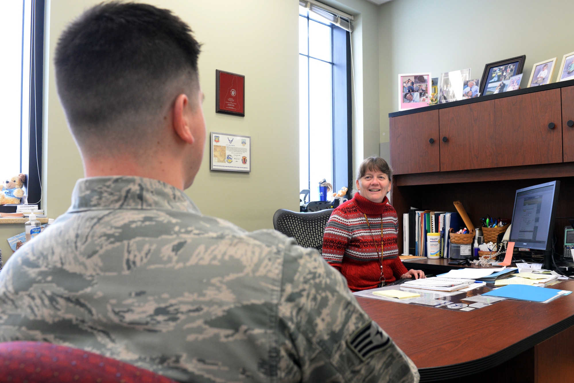 New Hampshire Air National Guard Airman and Family Readiness Program Manager, Mrs. Bonnie Rice, speaks to Staff Sgt. Curtis J. White on Feb. 8, 2015 at Pease Air National Guard Base, N.H. The 157th Air Refueling Wing is one of seven reserve component units to be recognized during the 2014 Department of Defense Reserve Family Readiness Awards Ceremony to be held Feb. 27, at the Pentagon. (U.S. Air National Guard photo by Staff Sgt. Curtis J. Lenz)