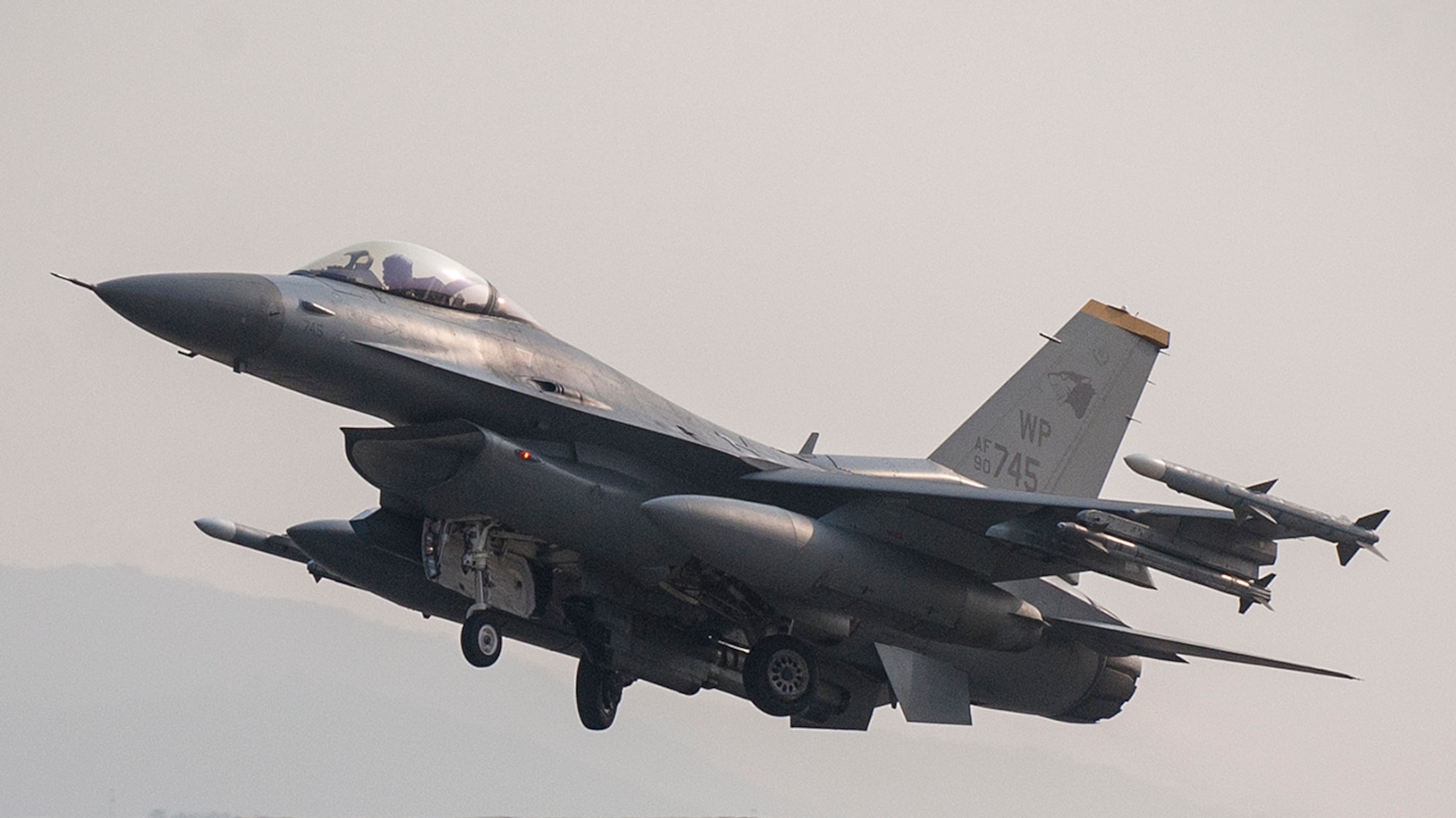 An F-16 Fighting Falcon from the 8th Fighter Wing takes off during Exercise Buddy Wing 15-2 at Daegu Air Base, Republic of Korea, Feb. 5, 2015. Buddy Wing exercises are held multiple times a year to not only enhance interoperability between USAF and ROKAF Airmen, but to promote cultural awareness through operating as one force as they integrate mission planning, briefing, flying and debriefing together. (U.S. Air Force photo by Senior Airman Katrina Heikkinen/Released)