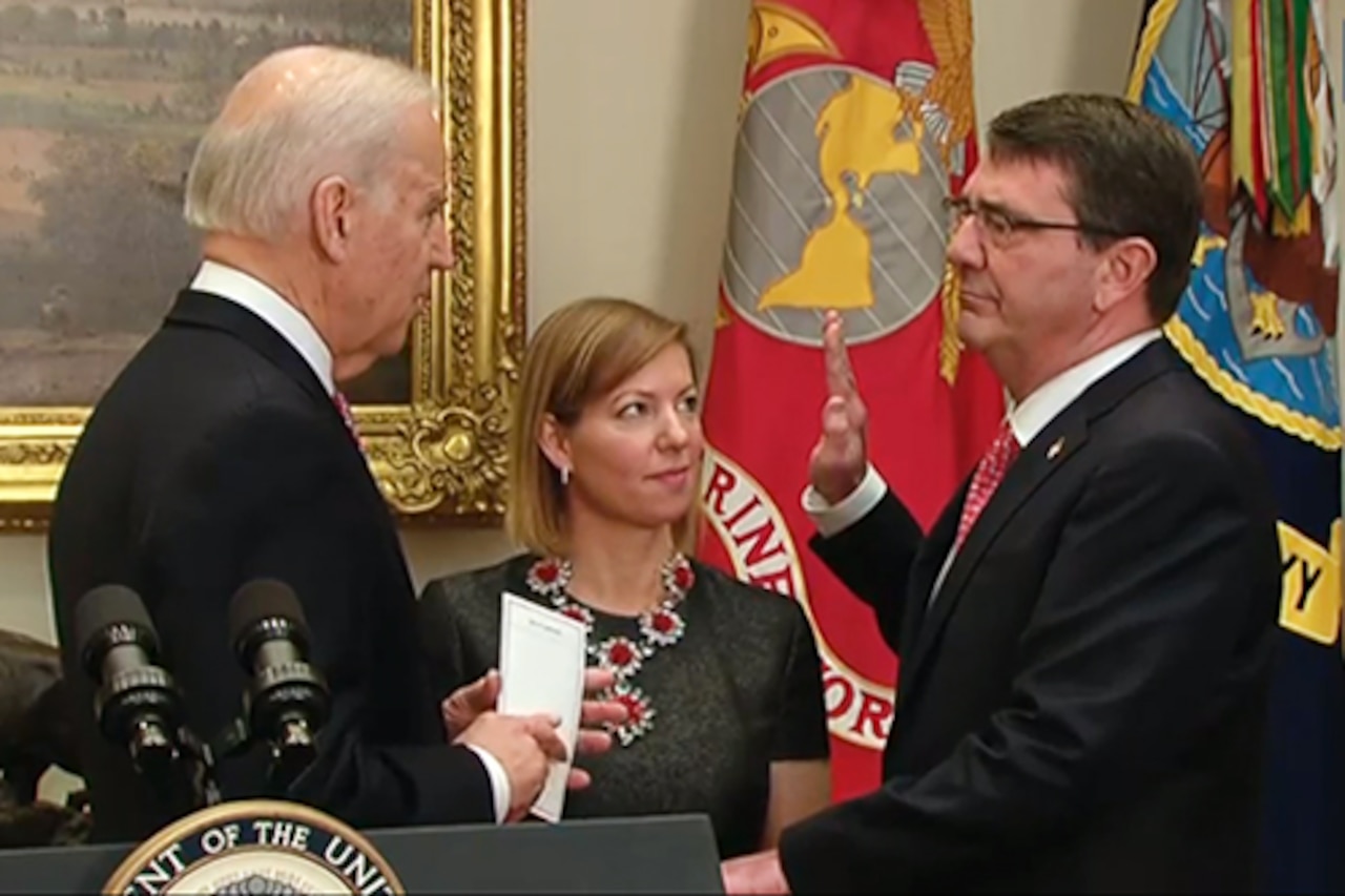 Vice President Joe Biden swears in Ash Carter as the 25th defense secretary as Carter's wife, Stephanie, looks on during a private ceremony at the White House, Feb. 17, 2015. DoD screen shot