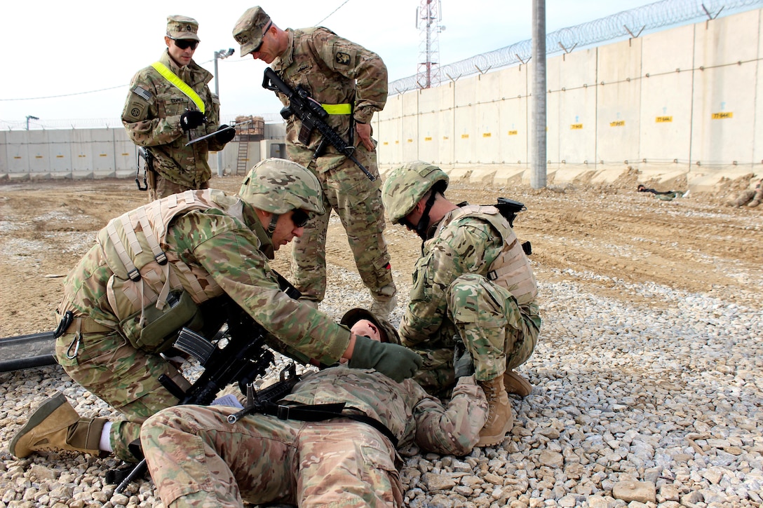 U.S. soldiers watch as Georgian soldiers respond to a possible security ...