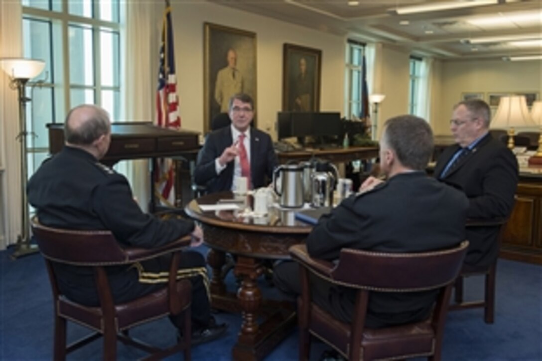 Incoming Defense Secretary Ash Carter hosts a "Big 4” round-table meeting with Deputy Defense Secretary Bob Work, right, Army Gen. Martin E. Dempsey, left, chairman of the Joint Chiefs of Staff, and Navy Adm. James A. Winnefeld Jr., vice chairman of the Joint Chiefs of Staff, at the Pentagon, Feb. 17, 2015, as Carter assumed his new duties.